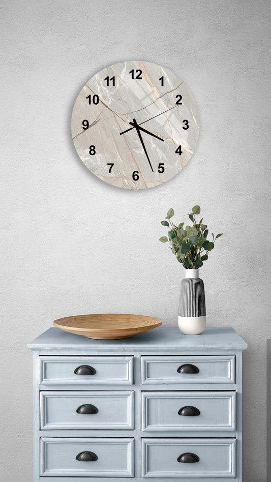 a light blue wooden dresser with a round clock mounted on the wall above it. The dresser has six drawers and a vase with greenery on top.