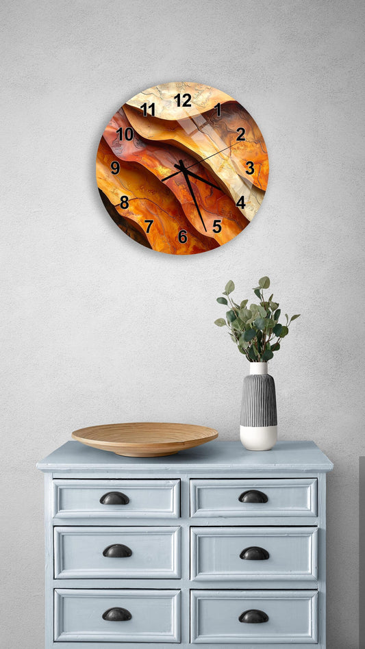 a wall clock with a unique abstract design, mounted on a wall above a light blue dresser with six drawers. The dresser also has a vase with greenery on it, and there is a wooden plate on the dresser.