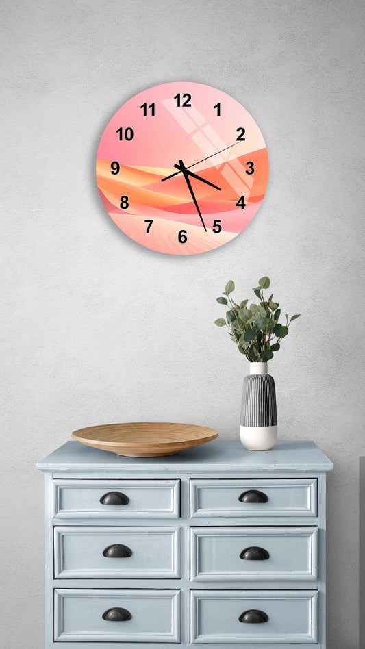 a wall clock with a pink and orange design, mounted on a wall above a light blue dresser with six drawers. The dresser also has a vase with greenery and a wooden tray on top.
