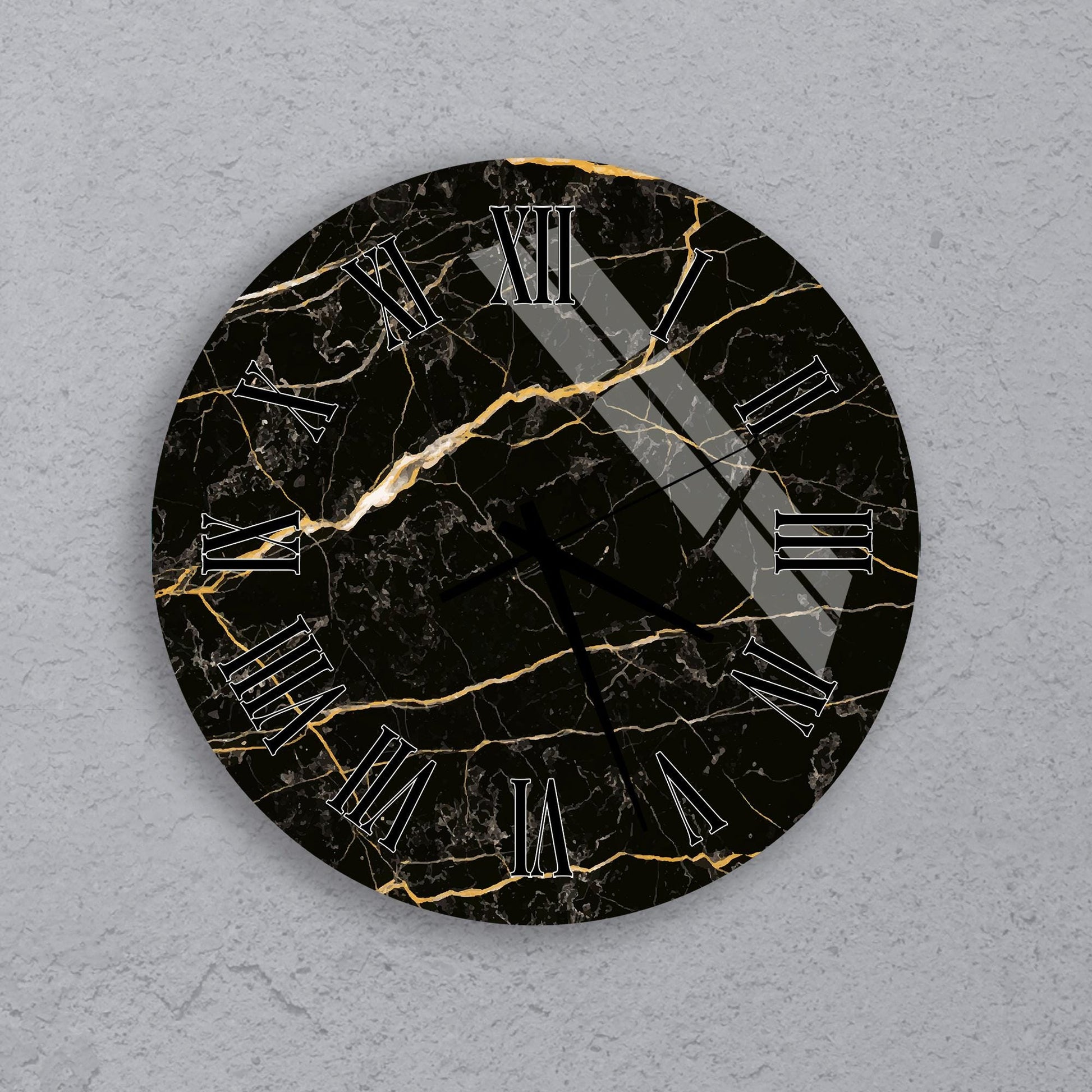 A black and gold marble-like clock face with Roman numerals.