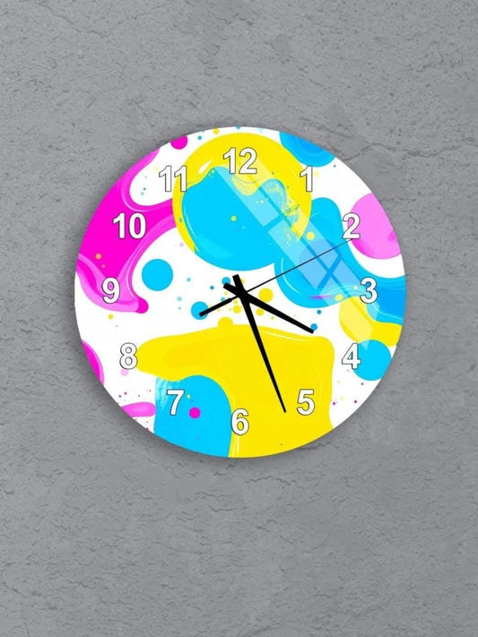 six colorful clocks with various designs and patterns, including polka dots, stripes, and abstract shapes, all set against a gray background.
