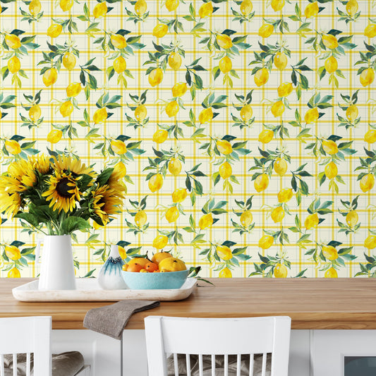 a dining table with a vase of sunflowers, a bowl of fruit, and a white chair. The table is set against a wall with a yellow and green checkered pattern.