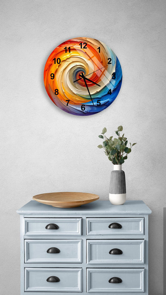 a colorful, spiral-patterned wall clock hanging on a wall above a light blue dresser with six drawers. The dresser also has a small plant and a wooden bowl on top of it.