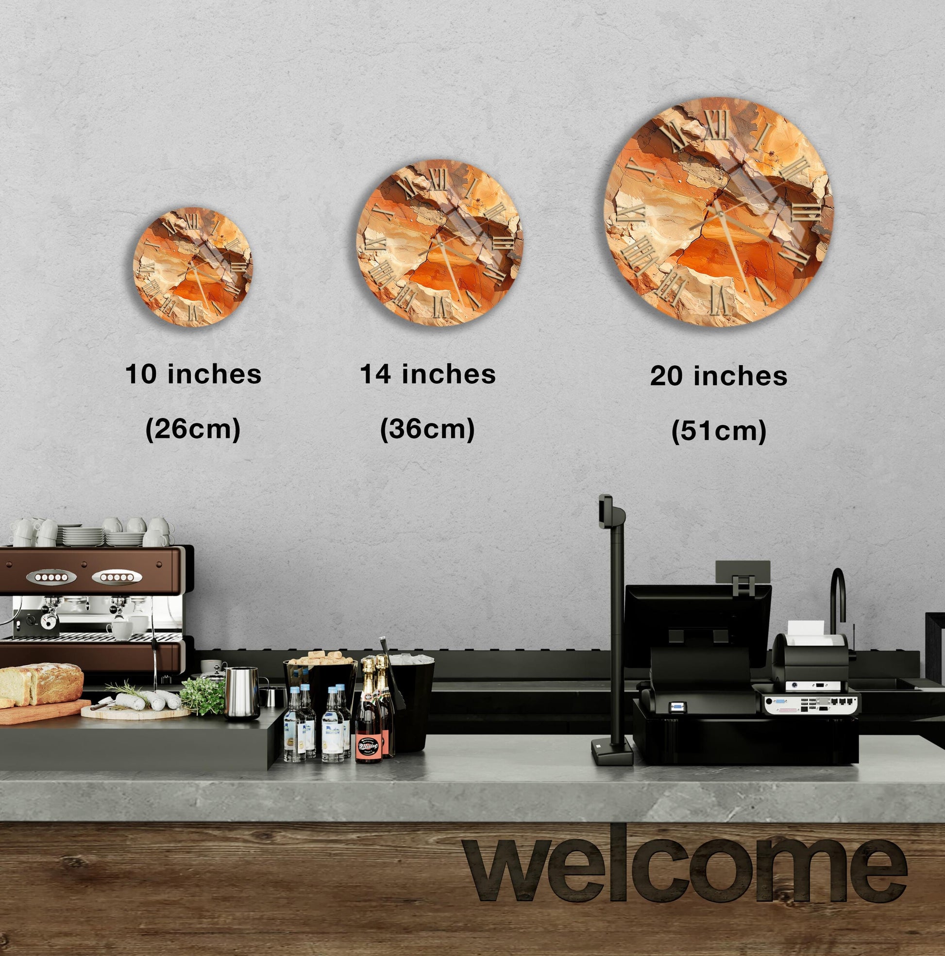 a counter with a cash register, a coffee machine, and a welcome sign. There are three clock images displayed on the wall, each representing a different size: 10 inches, 14 inches, and 20 inches.
