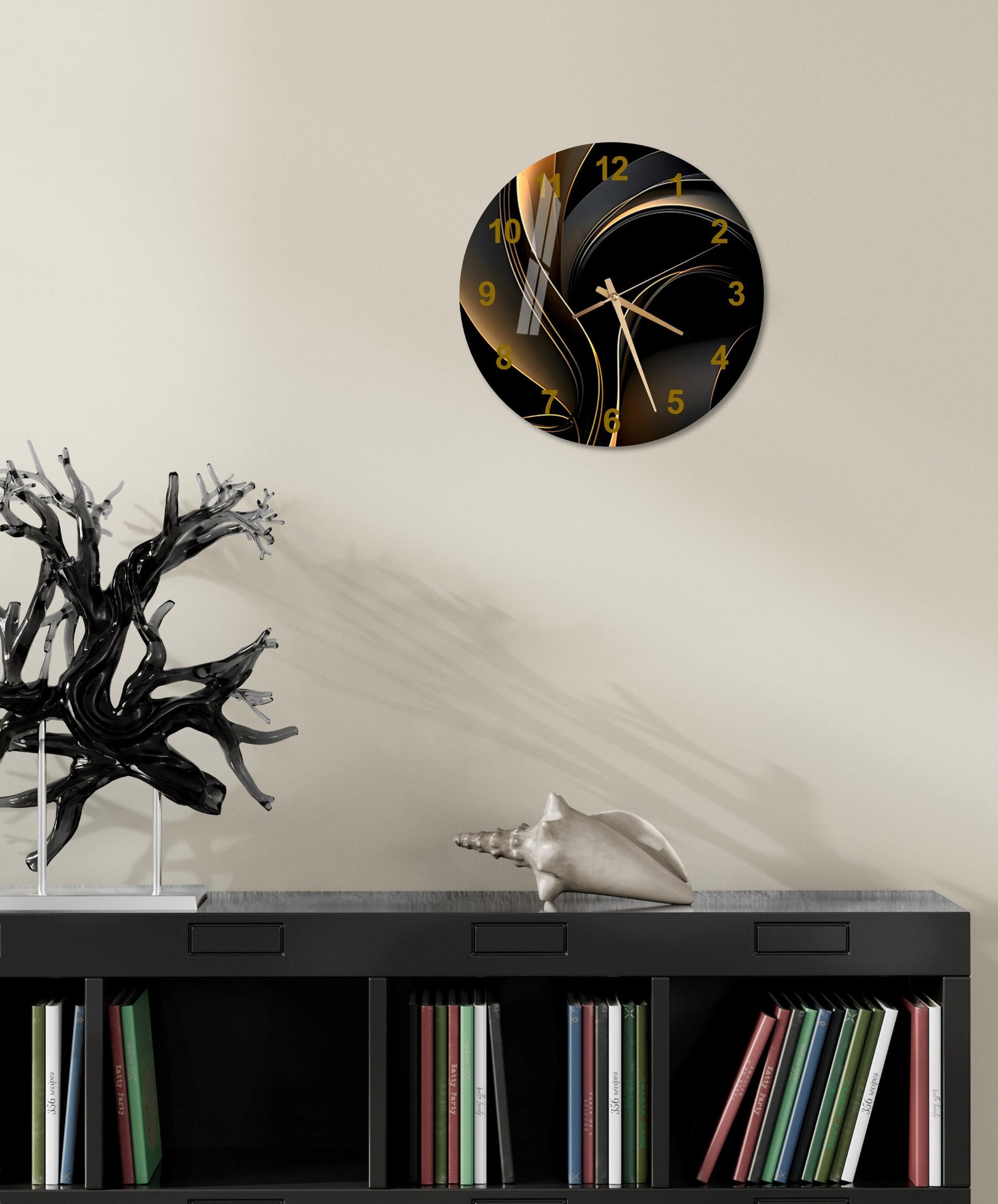 a black and gold clock on a white wall
