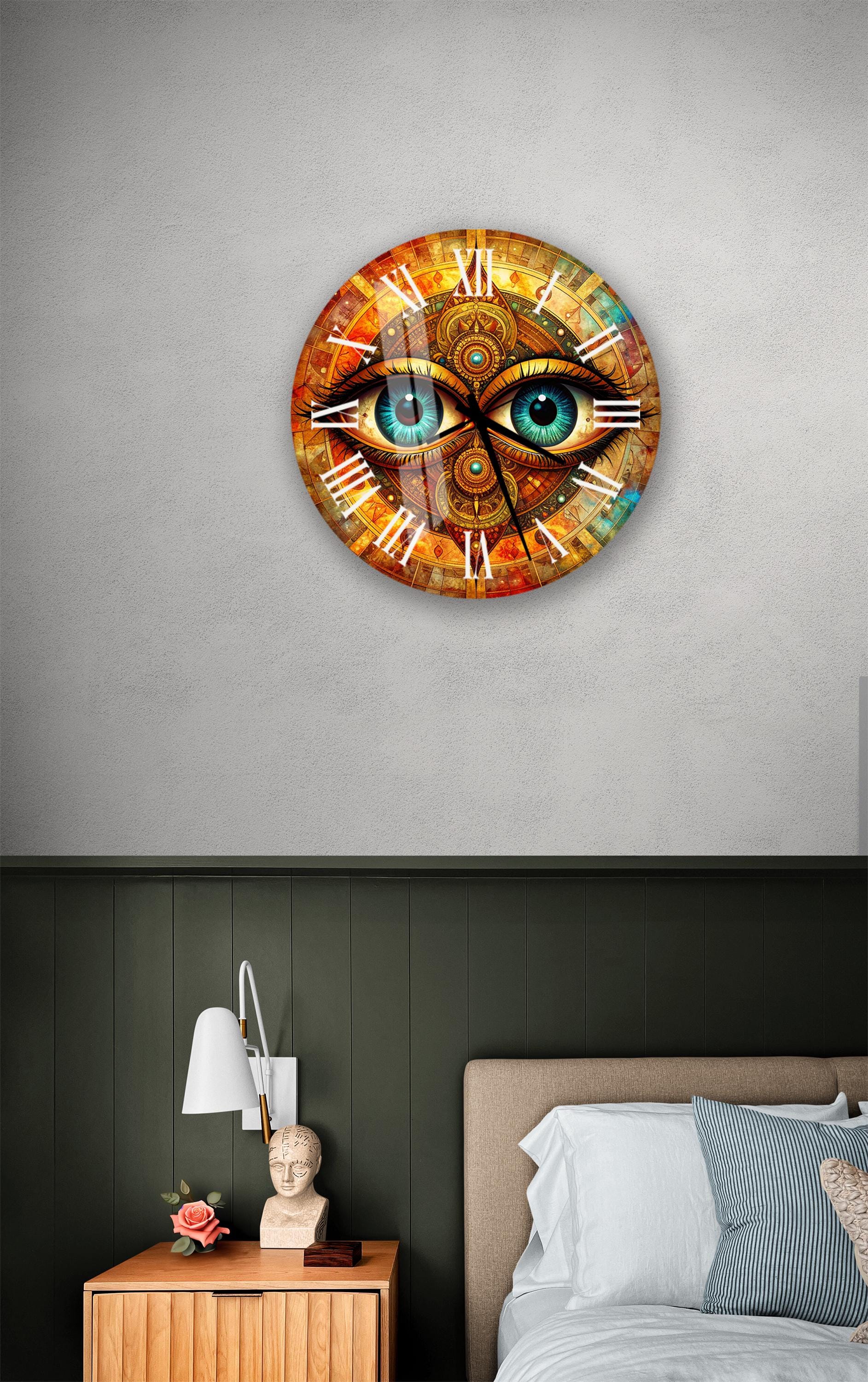 a clock with a unique design, featuring a pair of blue eyes on the face, mounted on a wall above a bedside table.