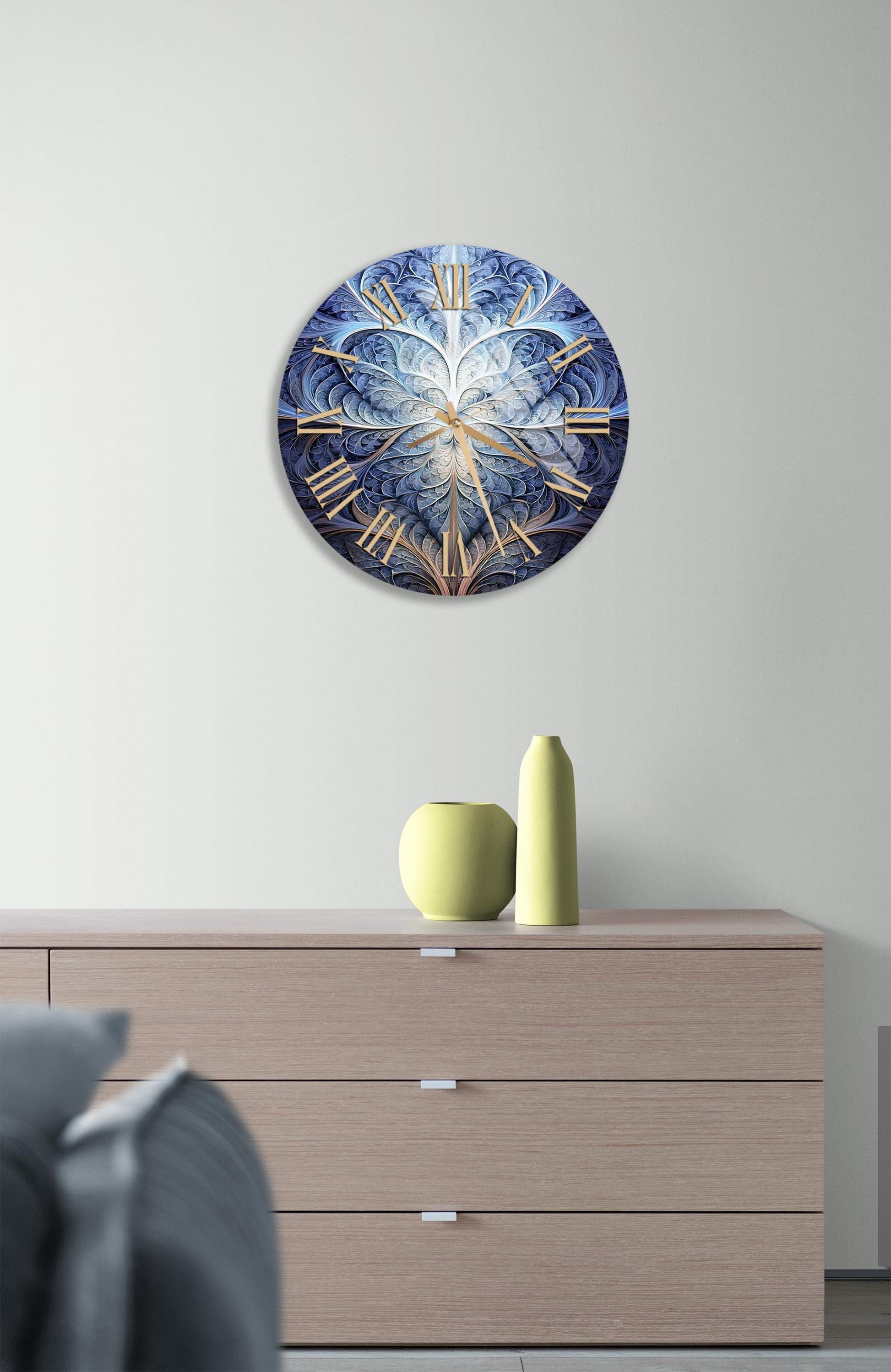 a clock on a wall above a dresser
