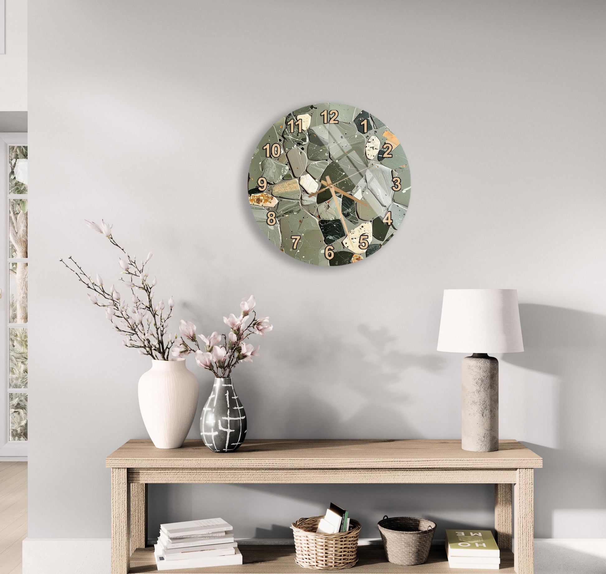 a modern living room with a wooden table, a lamp, a clock, and various decorative items such as a vase with flowers and a book.