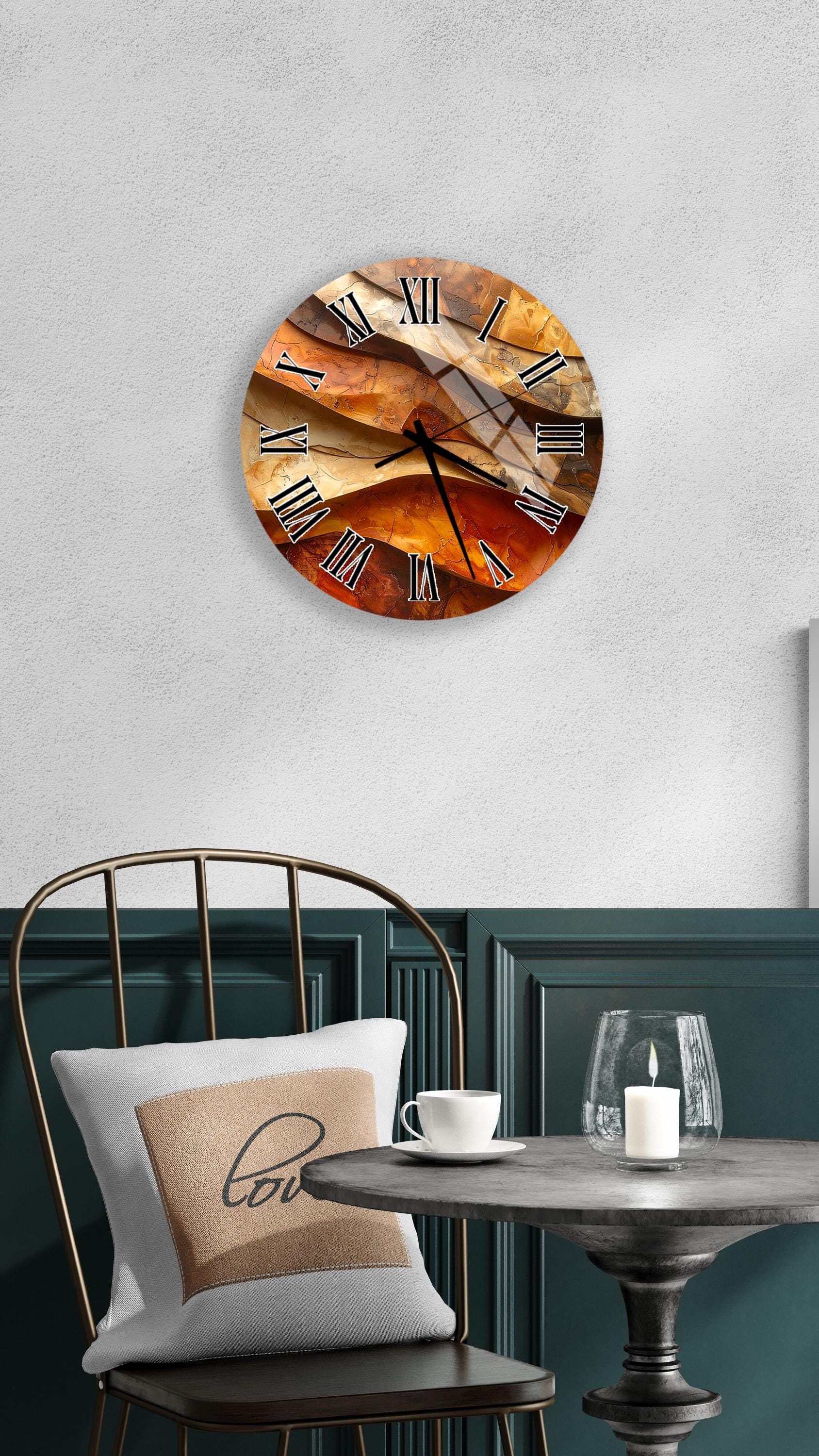 a wall clock with a unique, abstract design, mounted on a wall above a dining table with a white tablecloth.