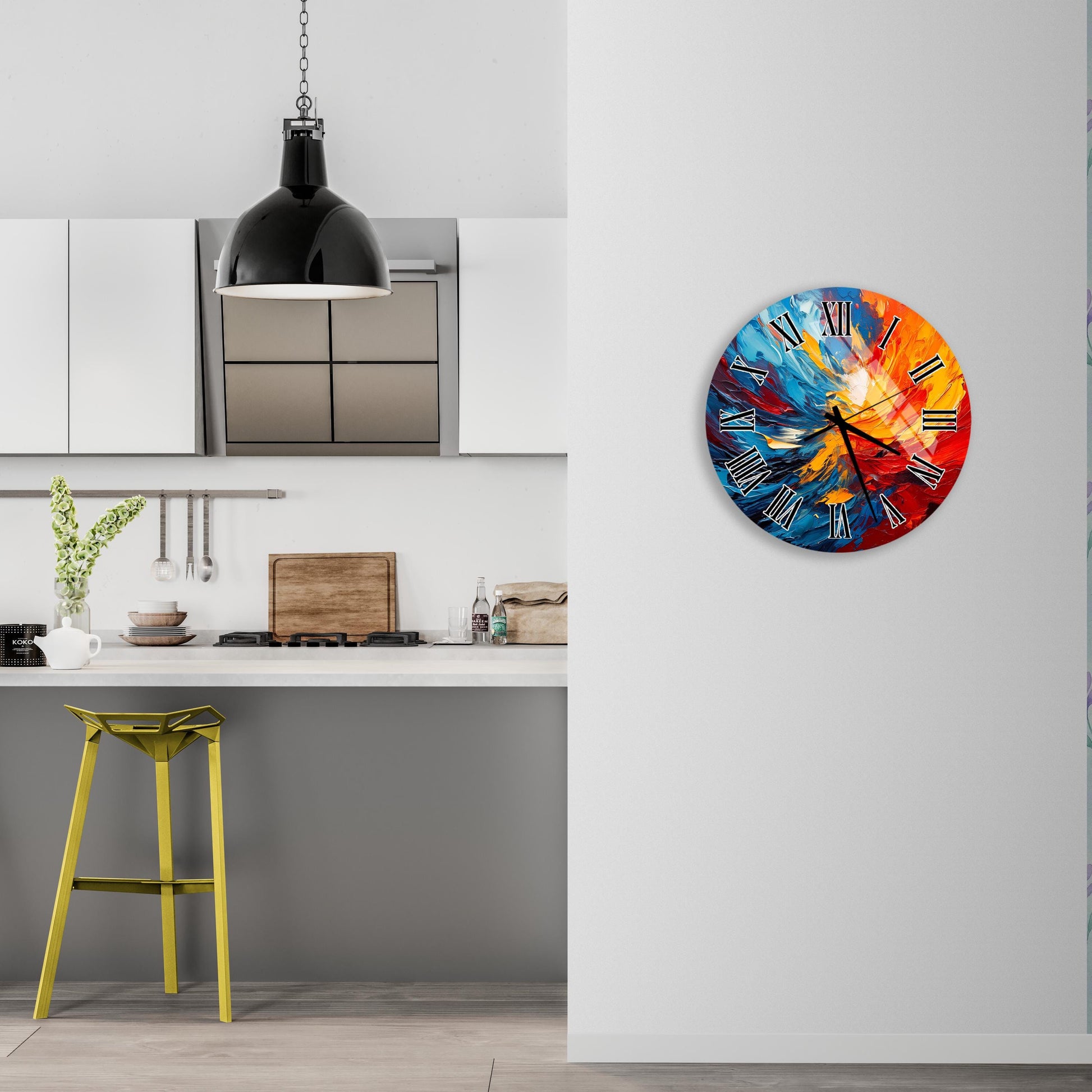 a kitchen with a colorful clock on the wall, a yellow stool, and a hanging light fixture.