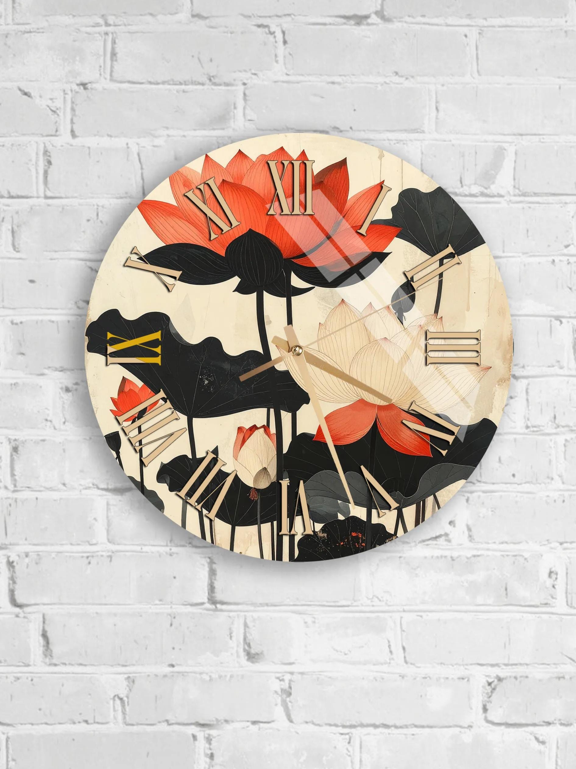 A round wall clock with a floral design featuring red and black flowers.