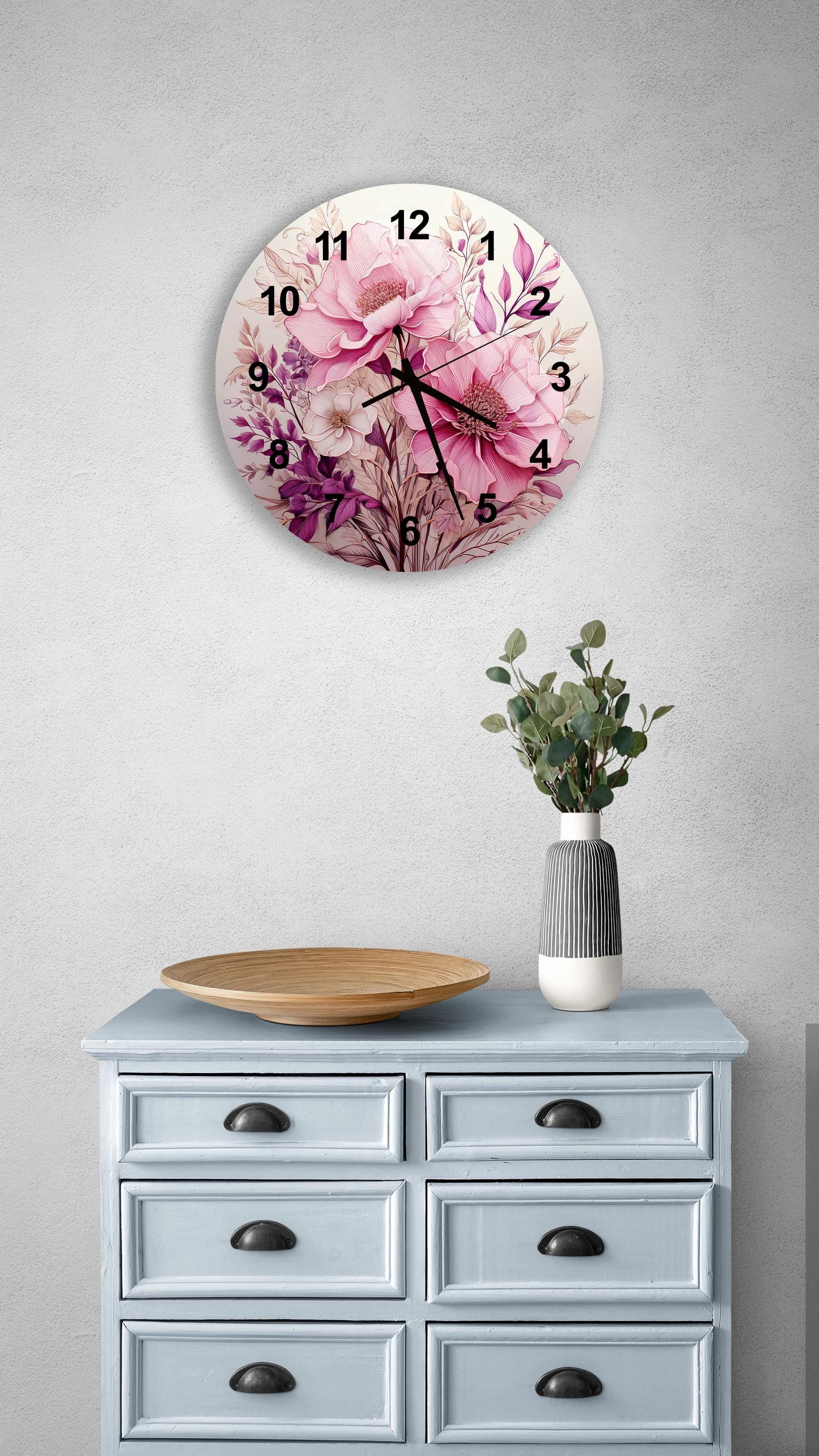 a clock on a wall above a dresser