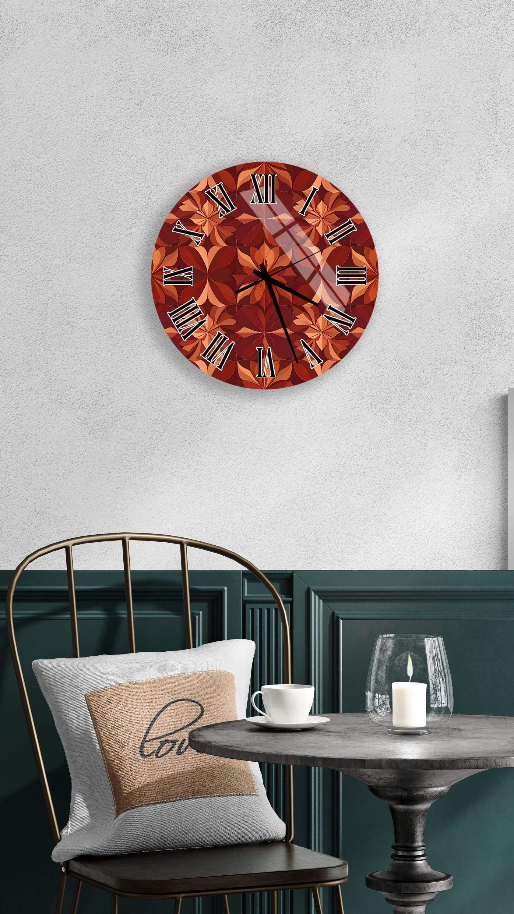 a wall clock with a floral design, a white table with a candle and a cup, and a chair with a pillow.