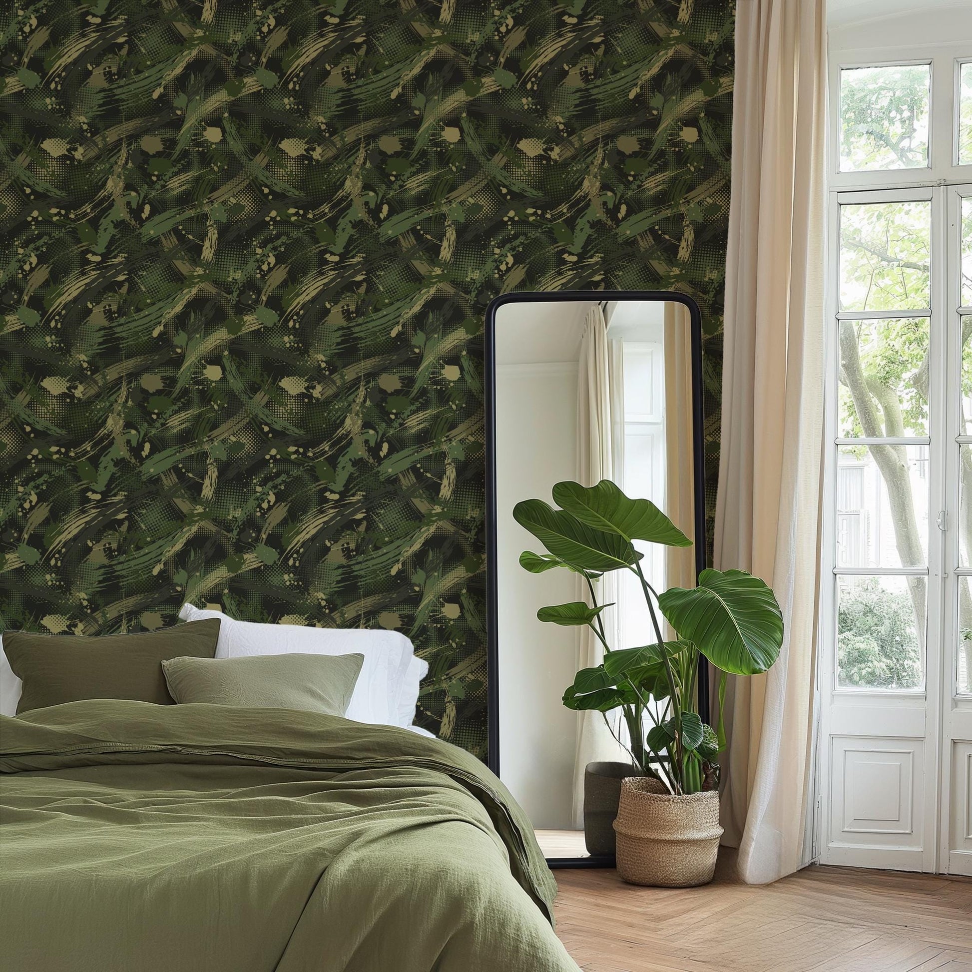 a bedroom with a large mirror, a bed with a green blanket, and a potted plant. The room has a green and brown color scheme, with a camouflage-like wallpaper on the wall.