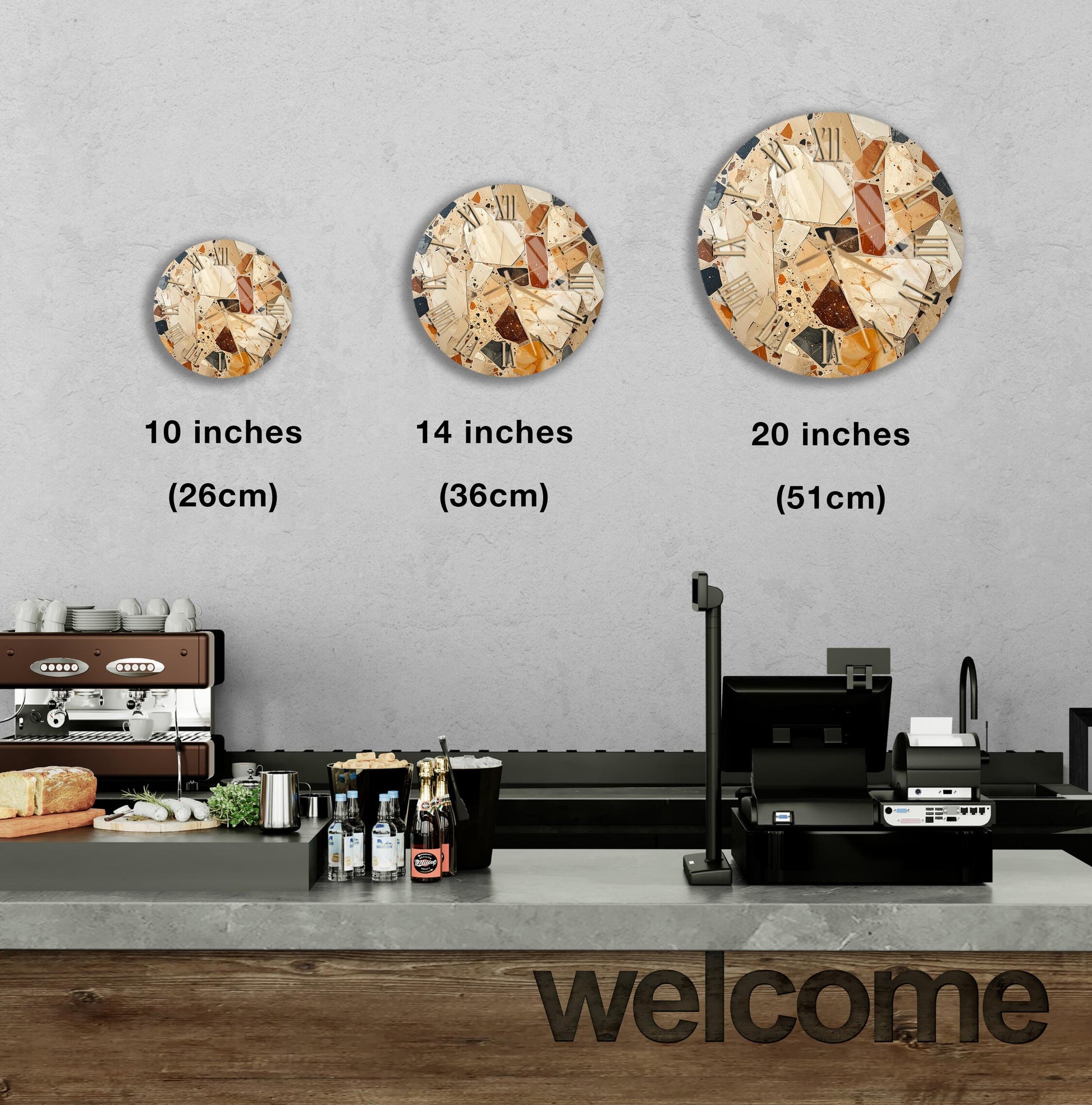 a counter in a restaurant with a "welcome" sign, and three different clock designs displayed on the wall above the counter.