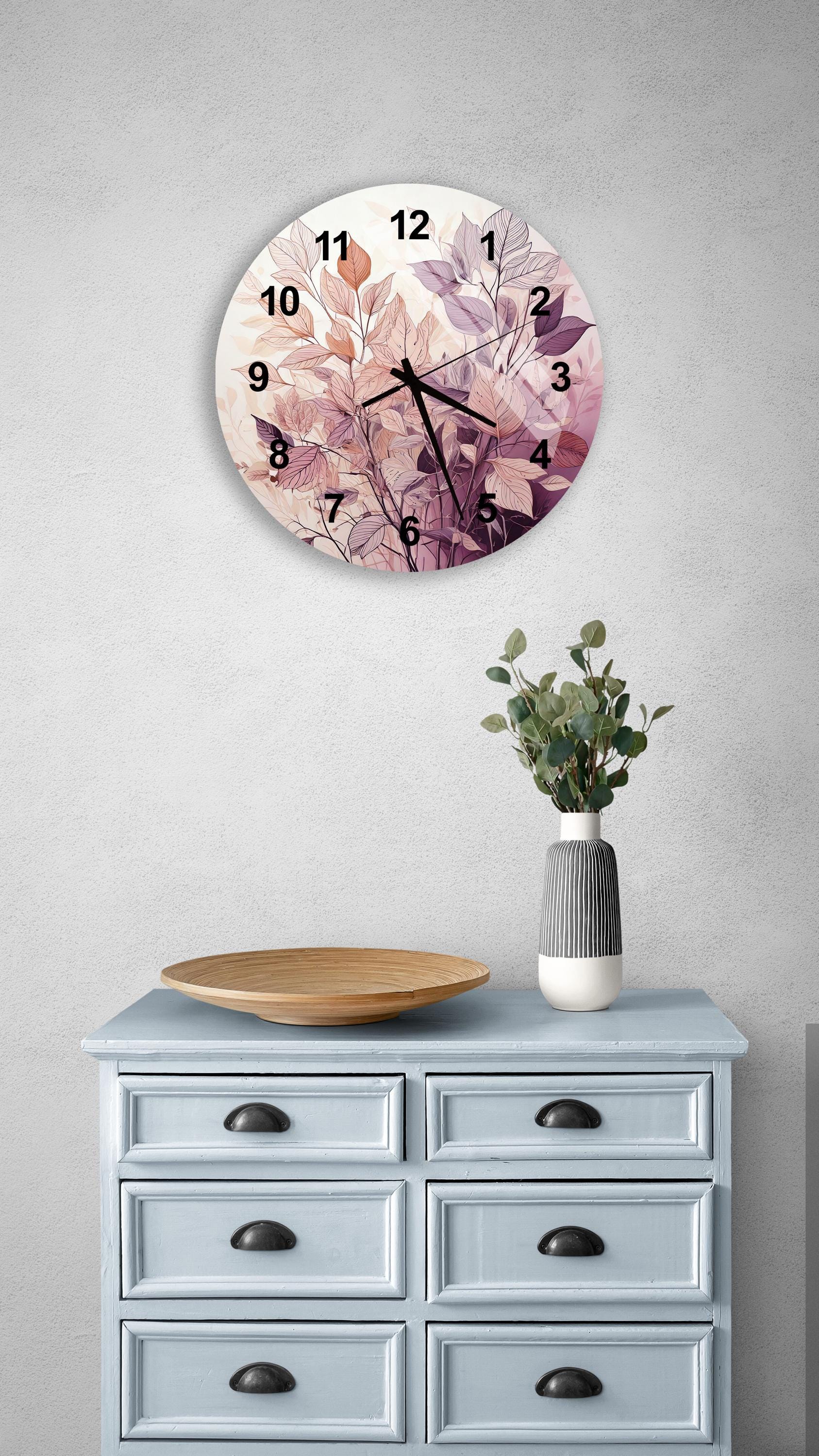 a clock on a wall above a dresser