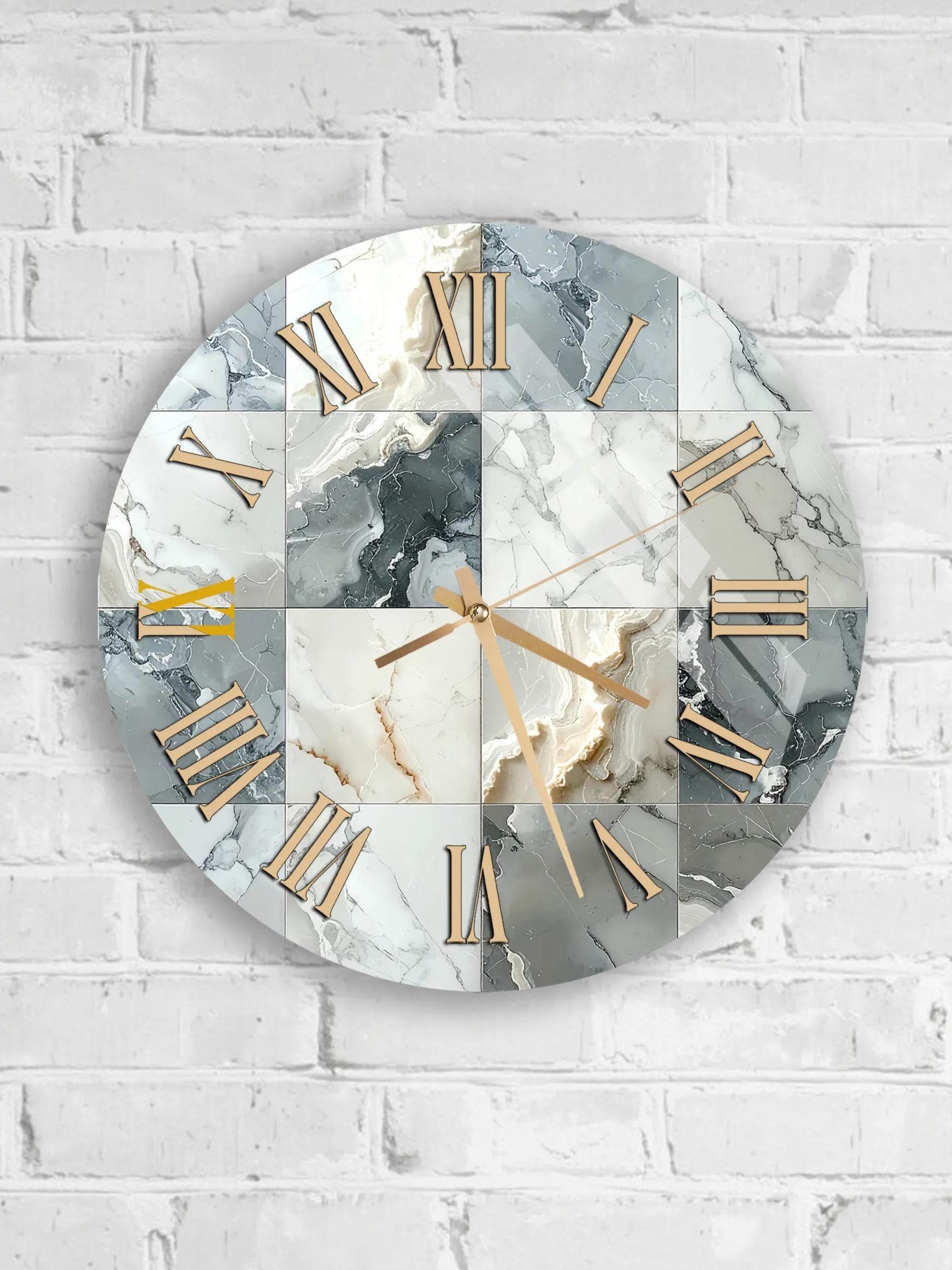 A round wall clock with a marble-like design and gold Roman numerals is mounted on a white brick wall.