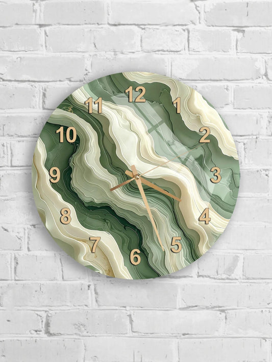 A wall clock with a marble-like design on a white brick wall.