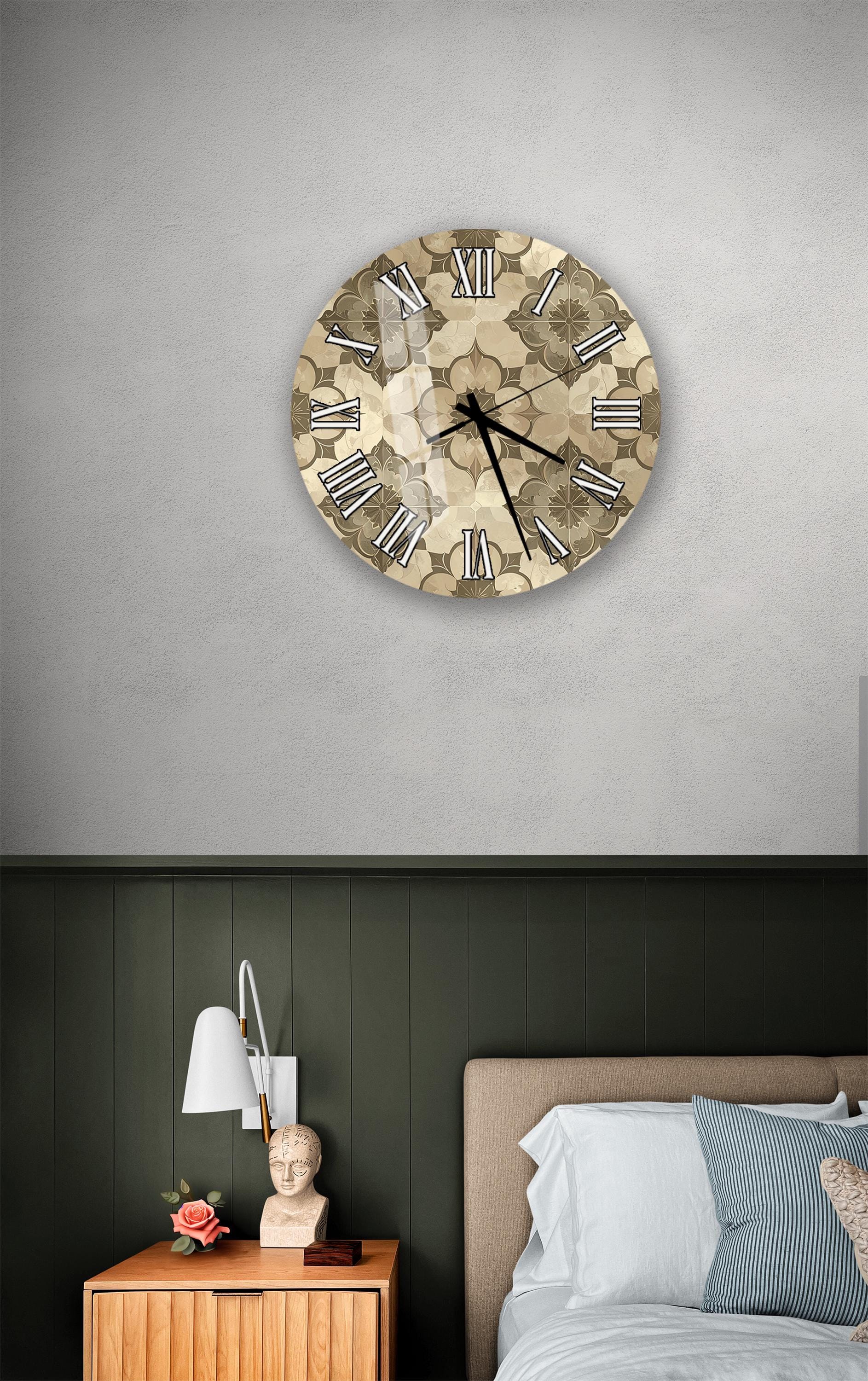 a bedroom setting with a clock on the wall, a nightstand with a lamp, and a bed with white sheets and pillows.