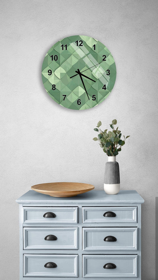 a wall clock with a green geometric design, a wooden bowl on a light blue dresser, and a vase with greenery.