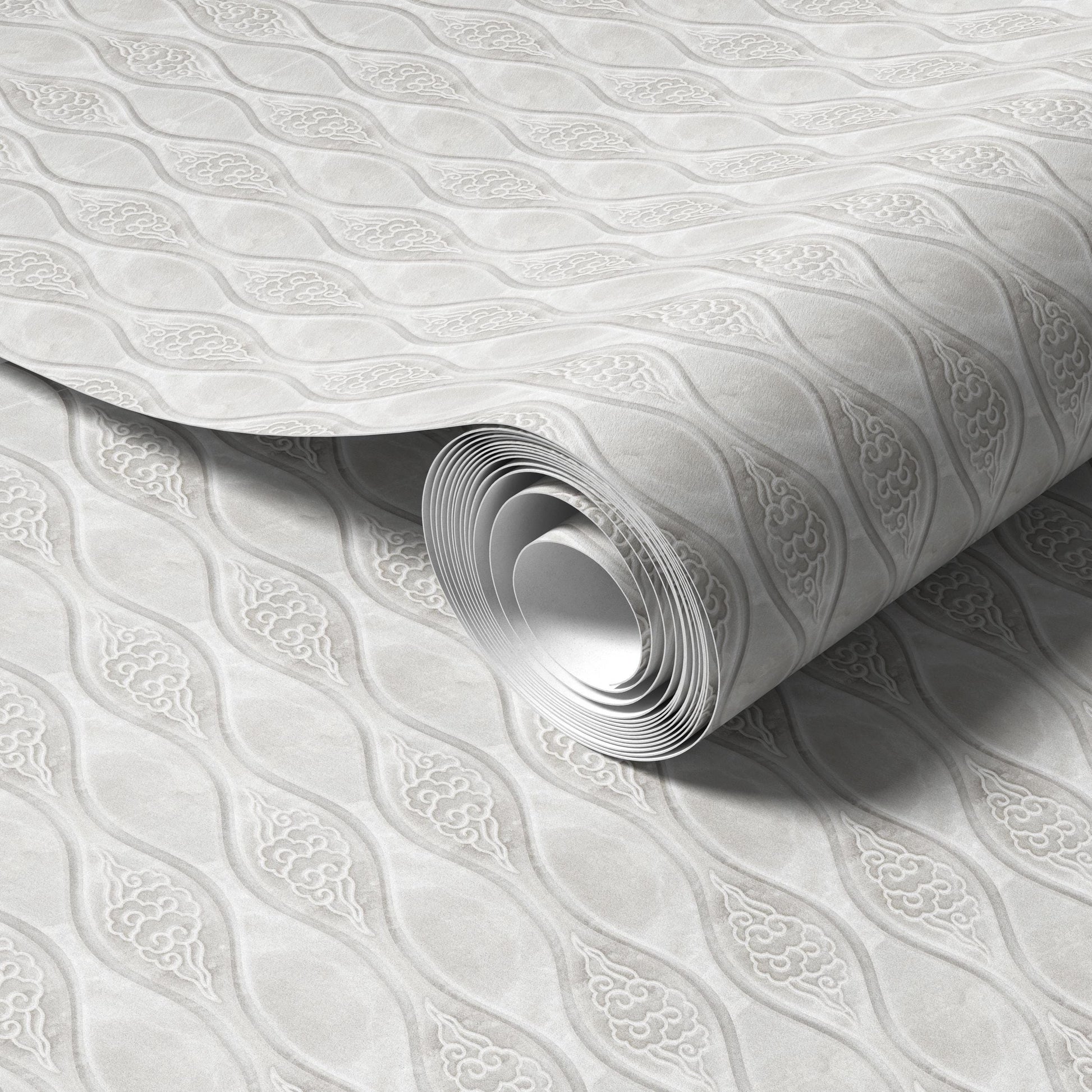 A roll of wallpaper with a repeating pattern of diamond shapes in shades of gray.