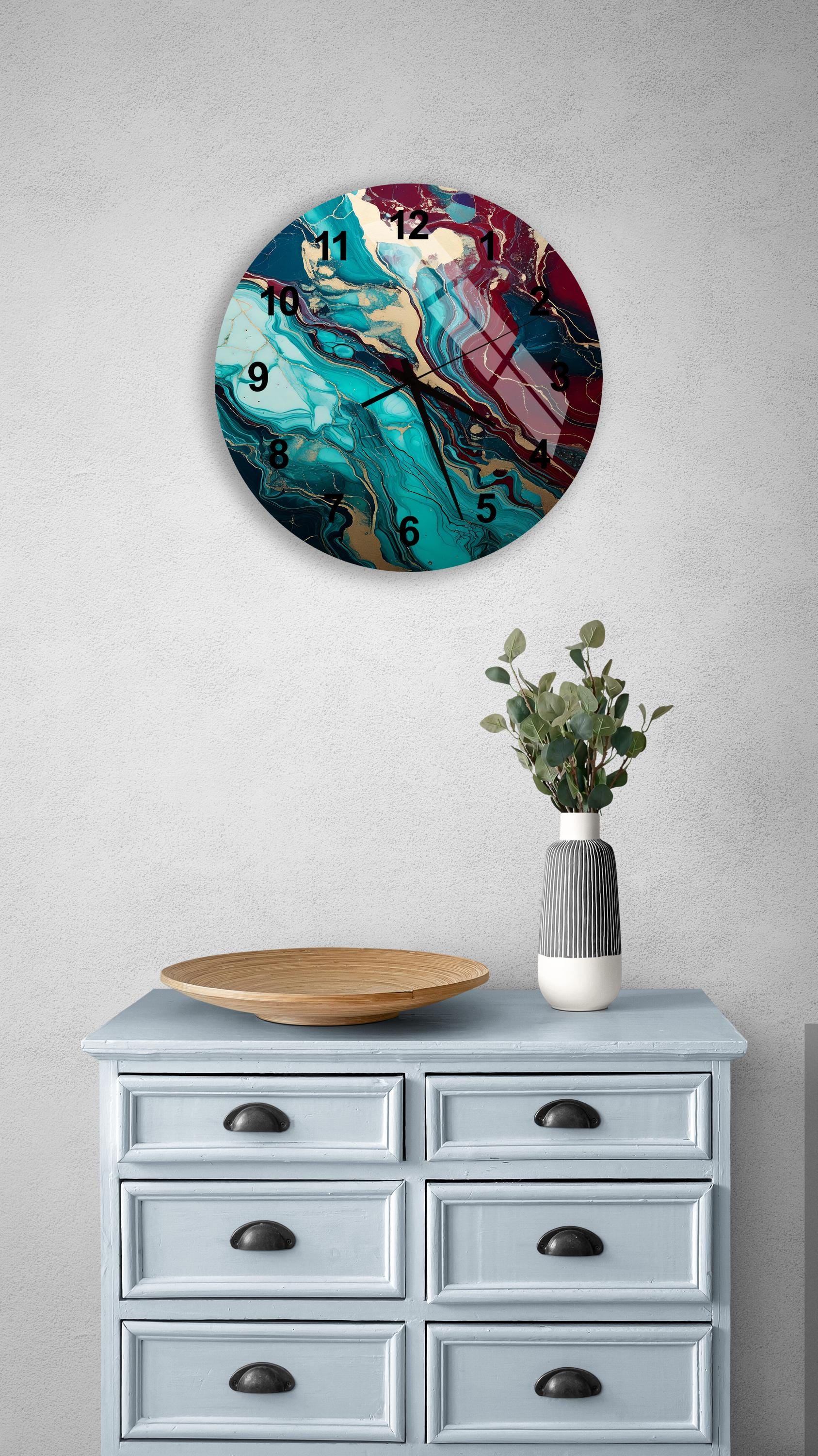 a clock on a wall above a dresser