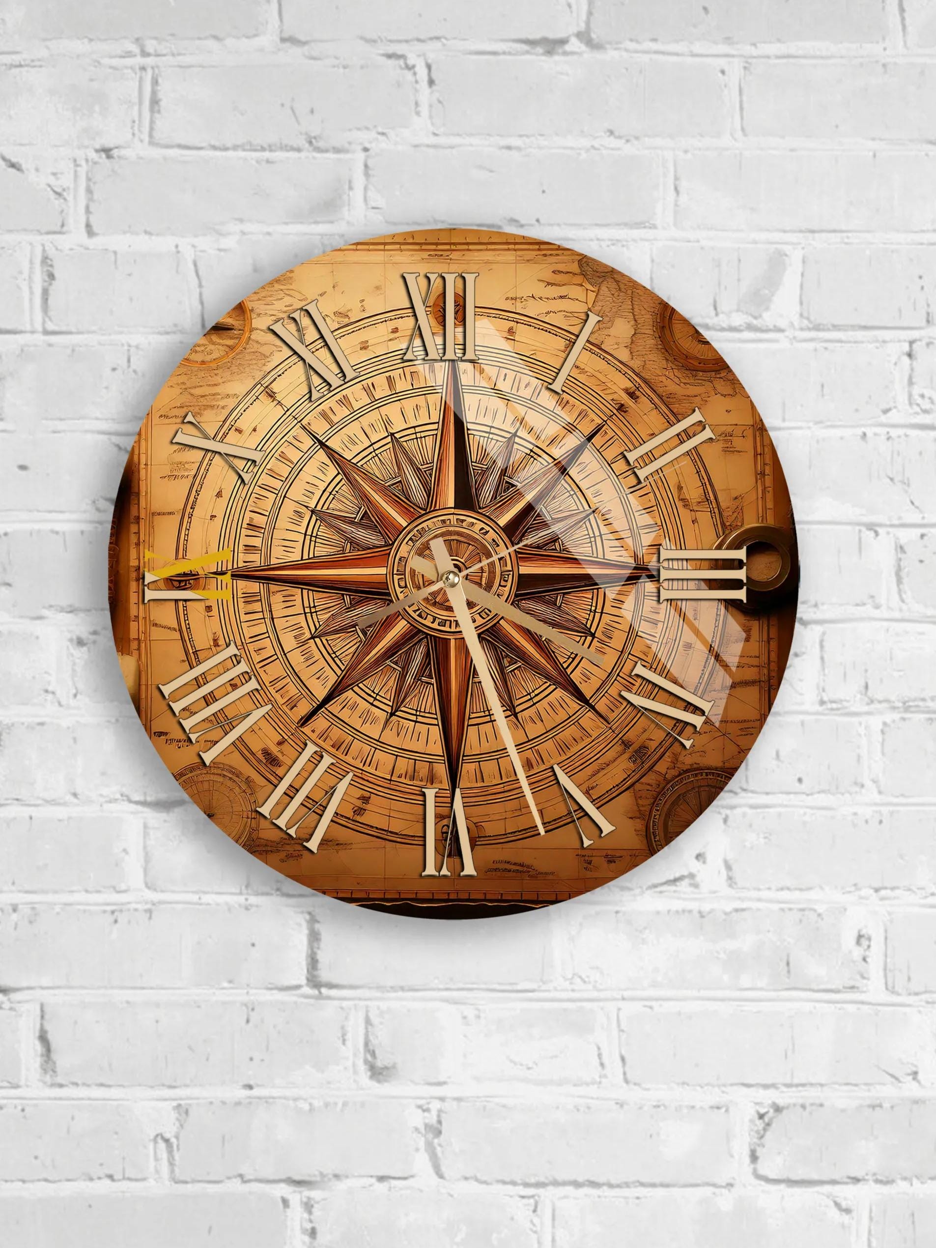 A round wall clock with Roman numerals and a compass rose design, mounted on a white brick wall.