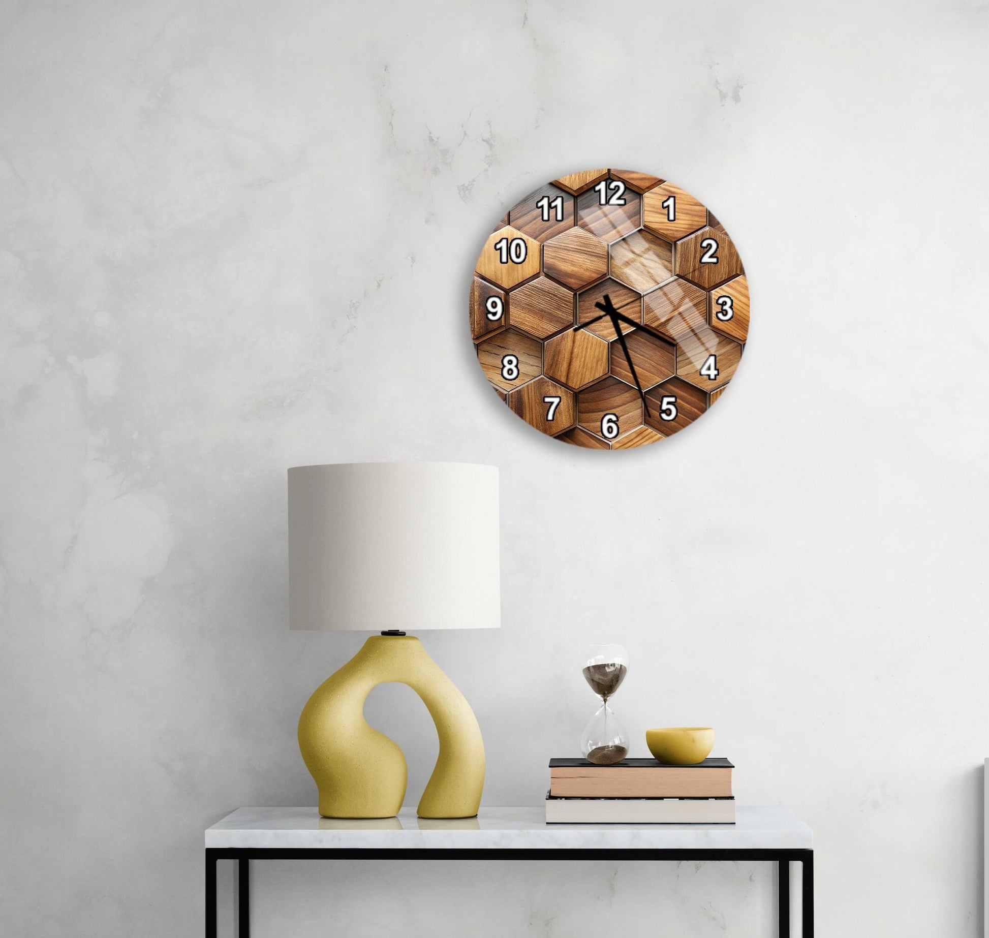 a modern, minimalist interior design with a white wall, a round wooden clock with a hexagonal pattern, a yellow lamp with a unique, curved base, and a small table with a book and a glass of water.