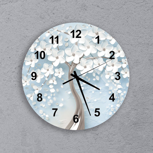 A wall clock with a white tree design on a blue background.