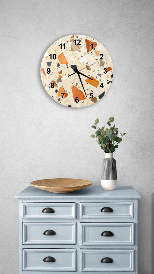 a wall clock with a unique, colorful design, a wooden tray on a light blue dresser, and a vase with greenery.