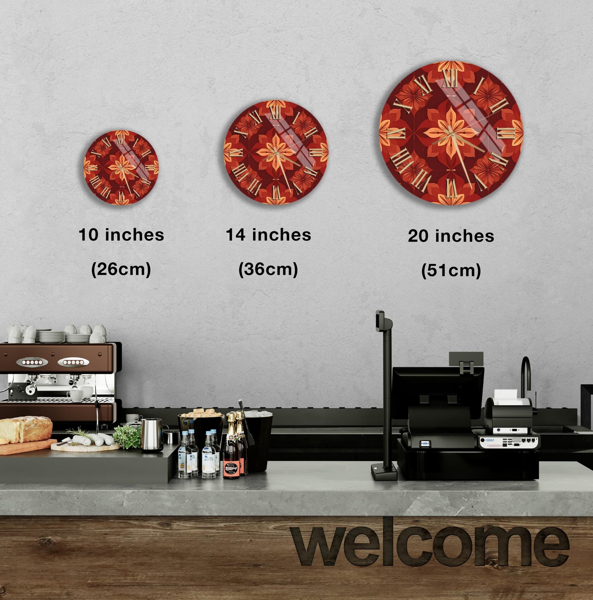 a wall with three clock designs of different sizes, ranging from 10 inches to 20 inches in diameter. Below the clocks, there is a counter with various items such as bottles and a cash register. The word "welcome" is also visible in the image.