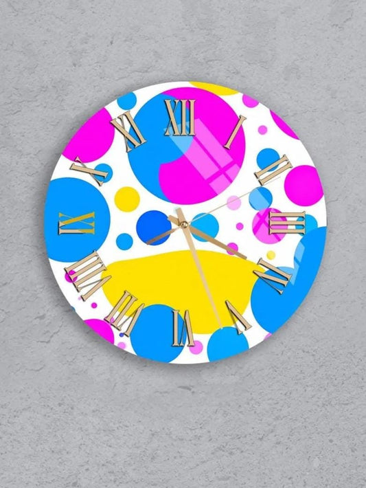 six colorful clocks with various patterns and designs, including polka dots, stripes, and other abstract shapes.
