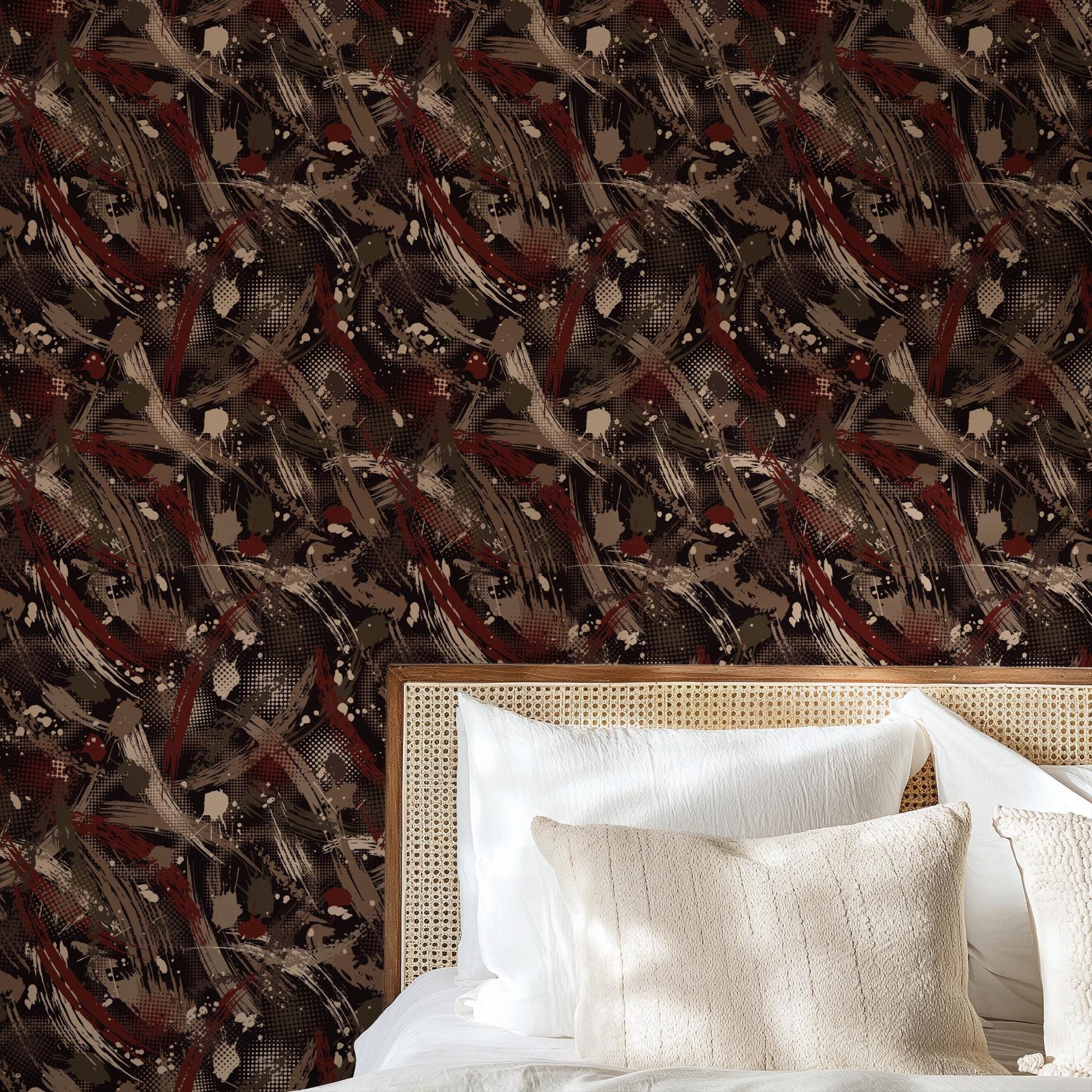a bedroom setting with a bed and a wallpapered wall. The wallpapered wall has a pattern of abstract shapes and lines in various shades of brown, red, and black. The bed has a wooden headboard and white pillows, creating a cozy and inviting atmosphere.