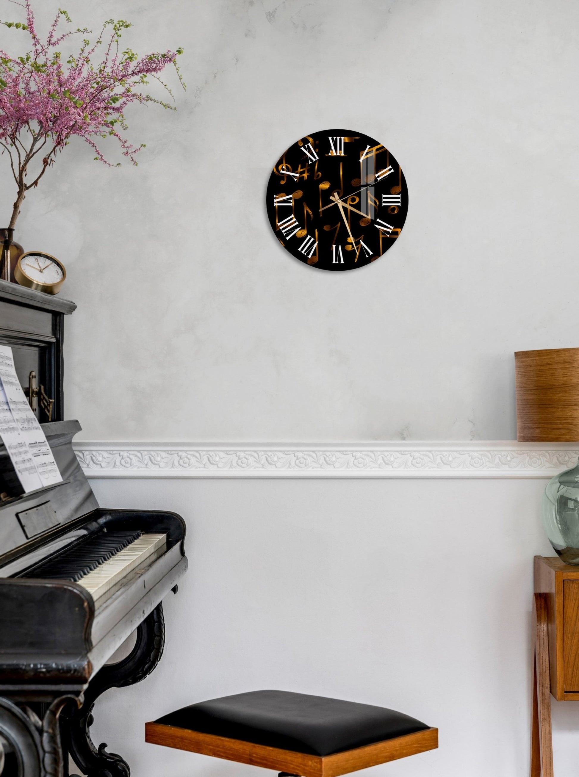 a clock that is on the wall above a piano