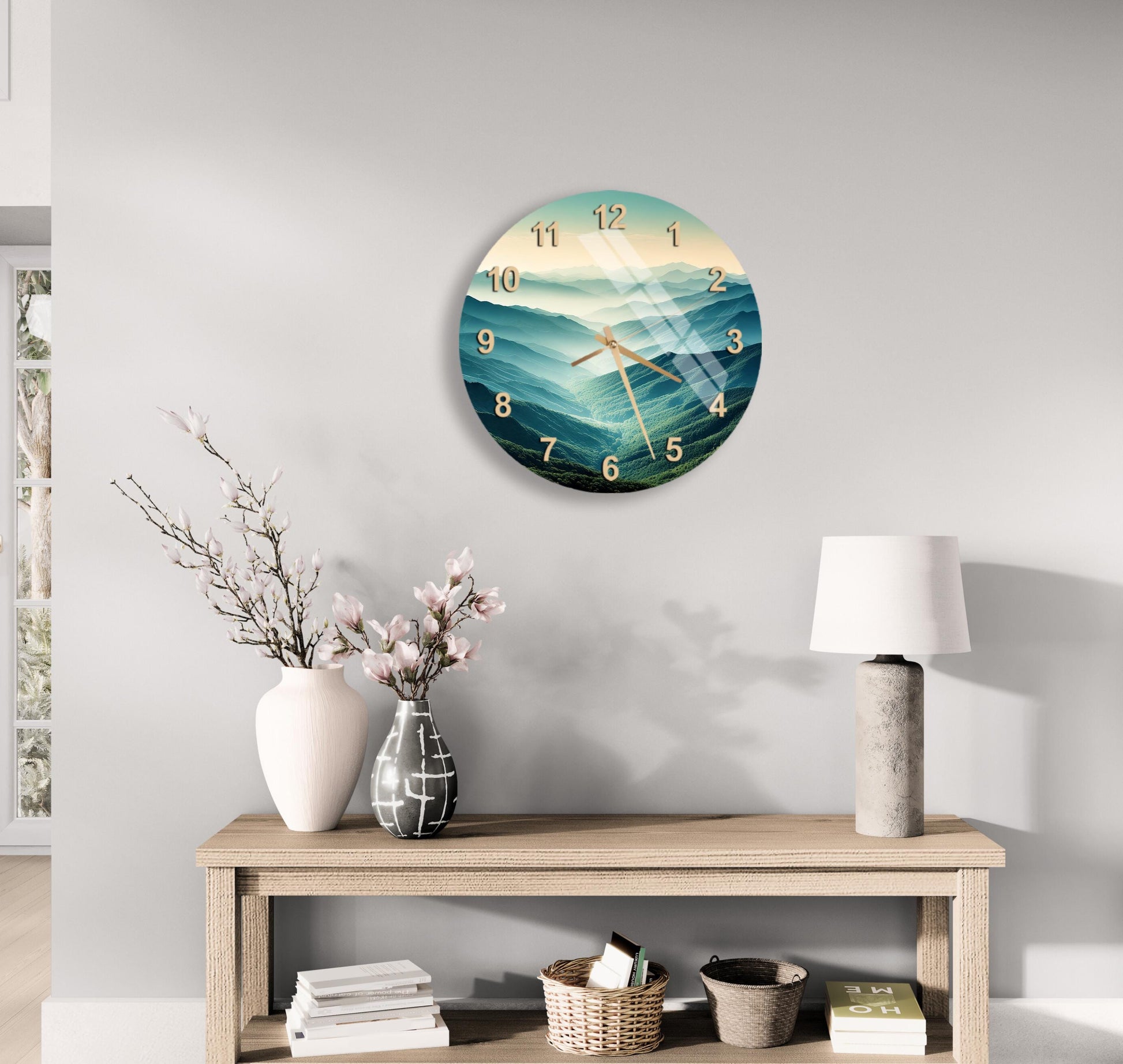 a clock on the wall above a table with a vase of flowers