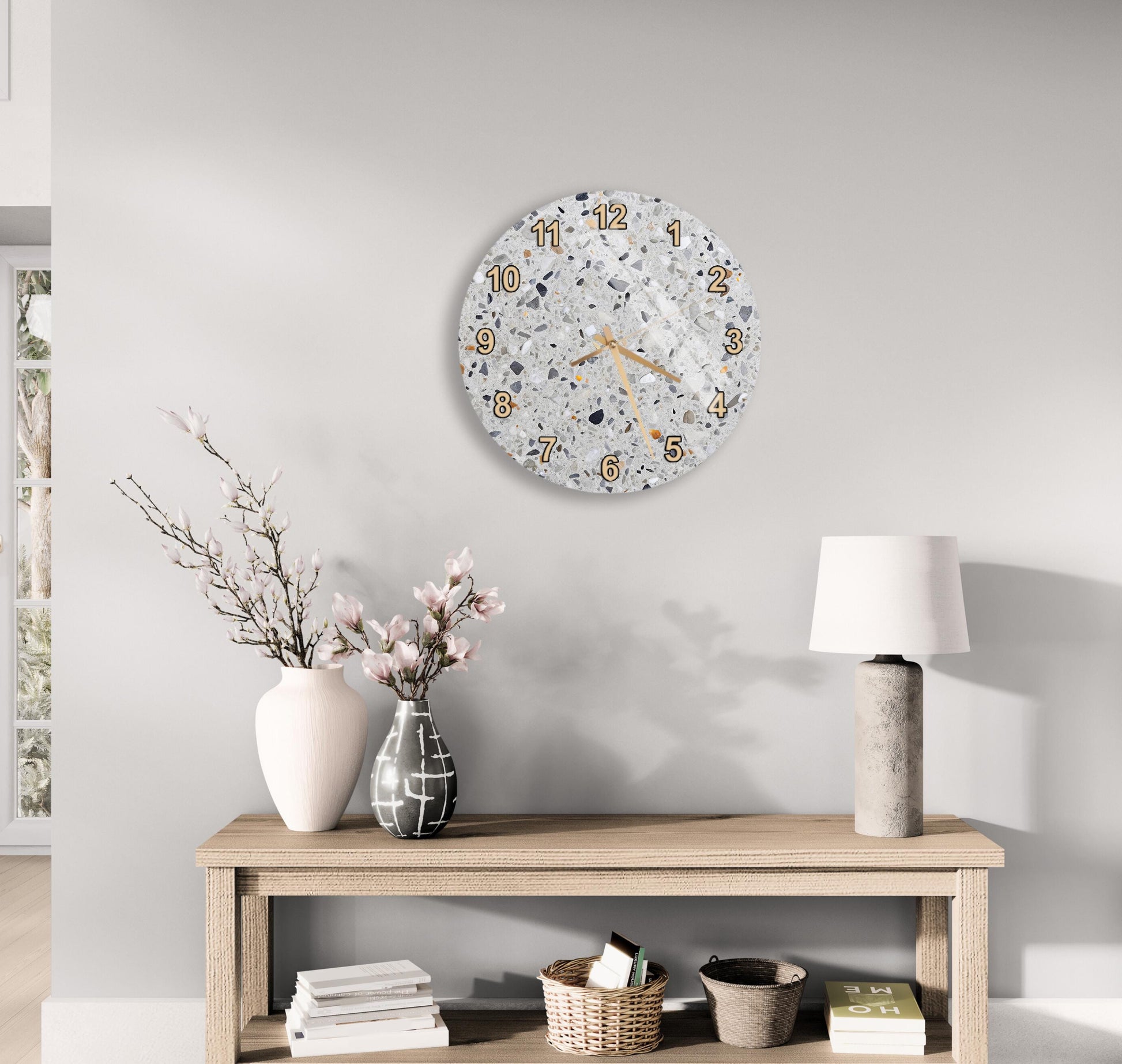 a modern living room with a wooden table, a lamp, a vase with flowers, and a wall clock.