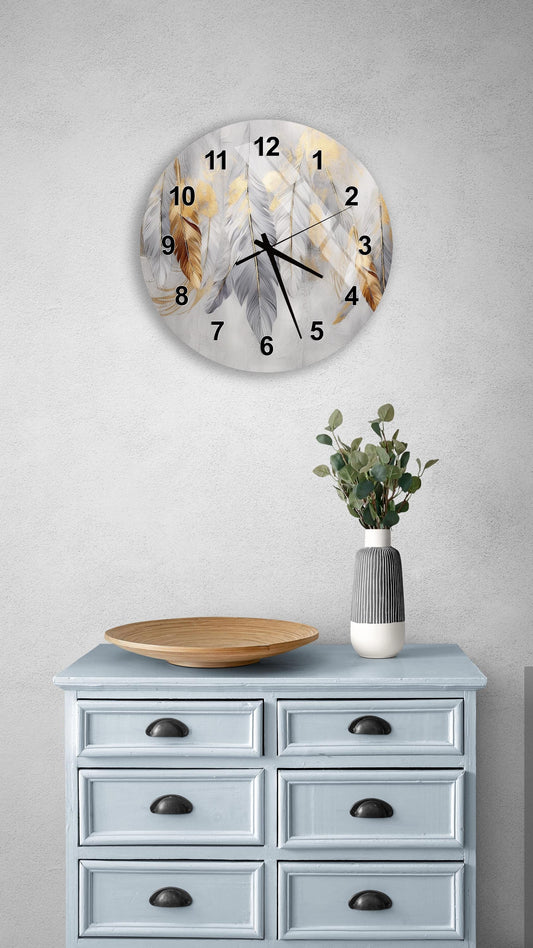 a wall clock with a feather design, a wooden tray, a vase with greenery, and a light blue dresser with six drawers.