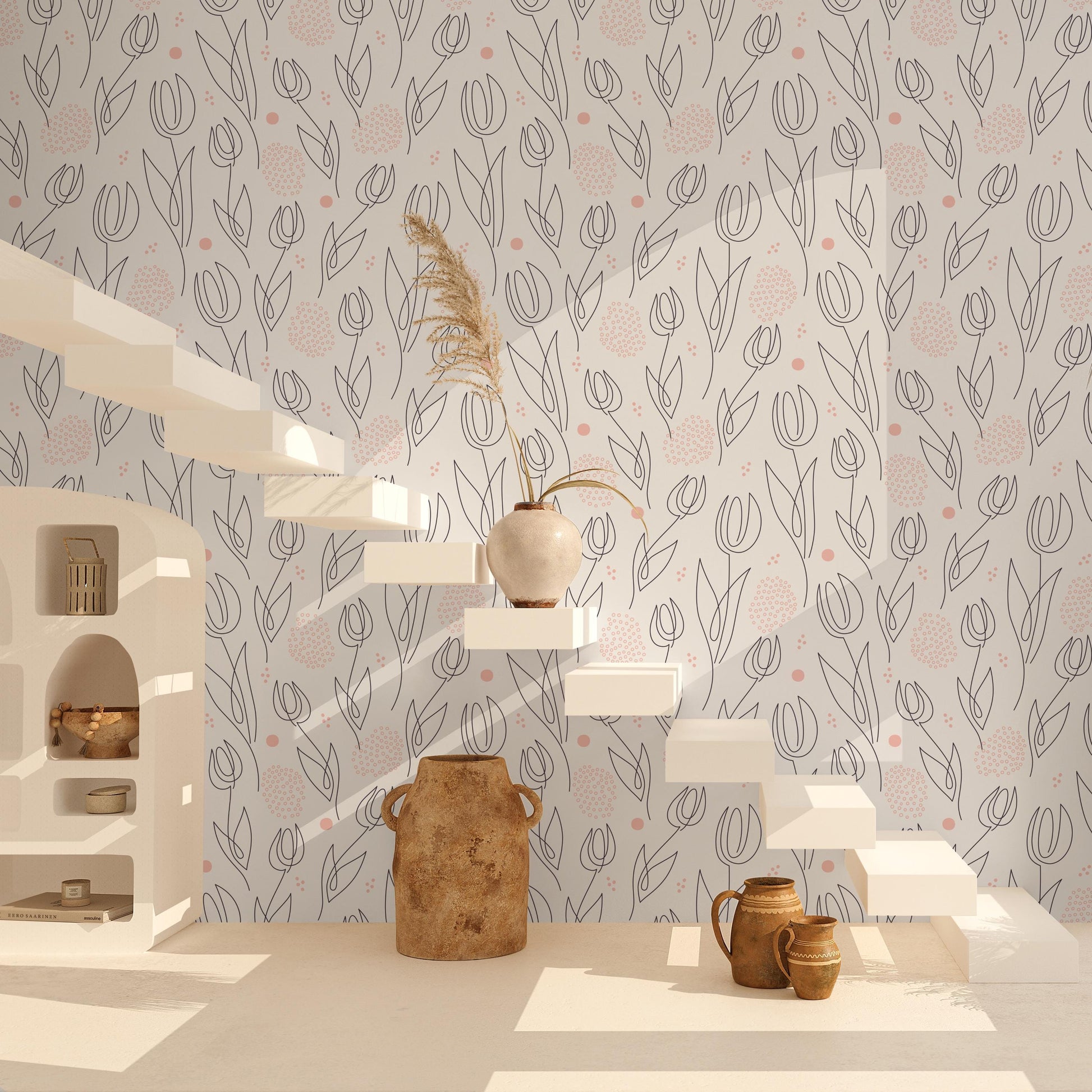 a minimalist and modern interior design with a floral pattern on the wall, white shelves, and various decorative items such as a vase, a pitcher, and a potted plant.