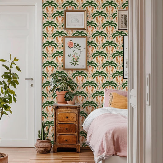 a bedroom with a bed, a wooden dresser, and a wallpapered wall with a tropical pattern. There are also some framed pictures and a potted plant in the room.