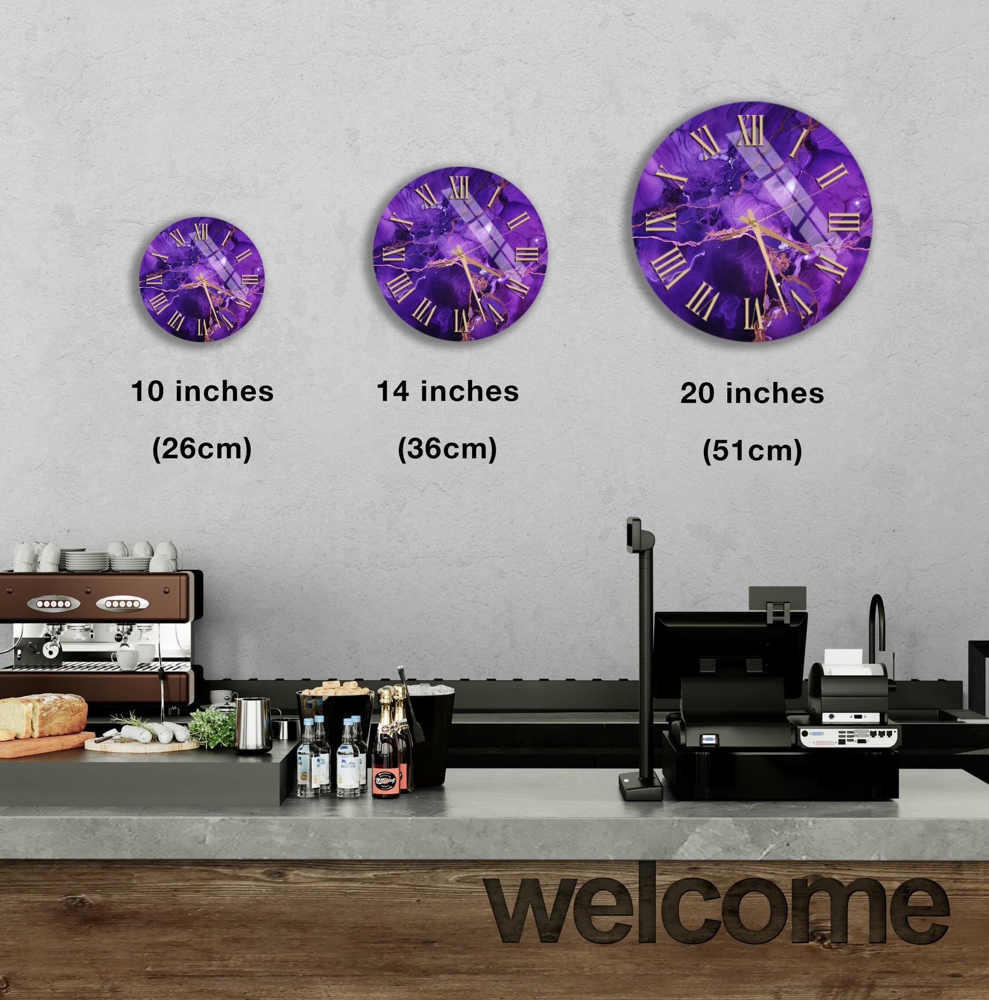 a wall clock with purple and gold designs, and there are three different sizes of the clock displayed on the wall.