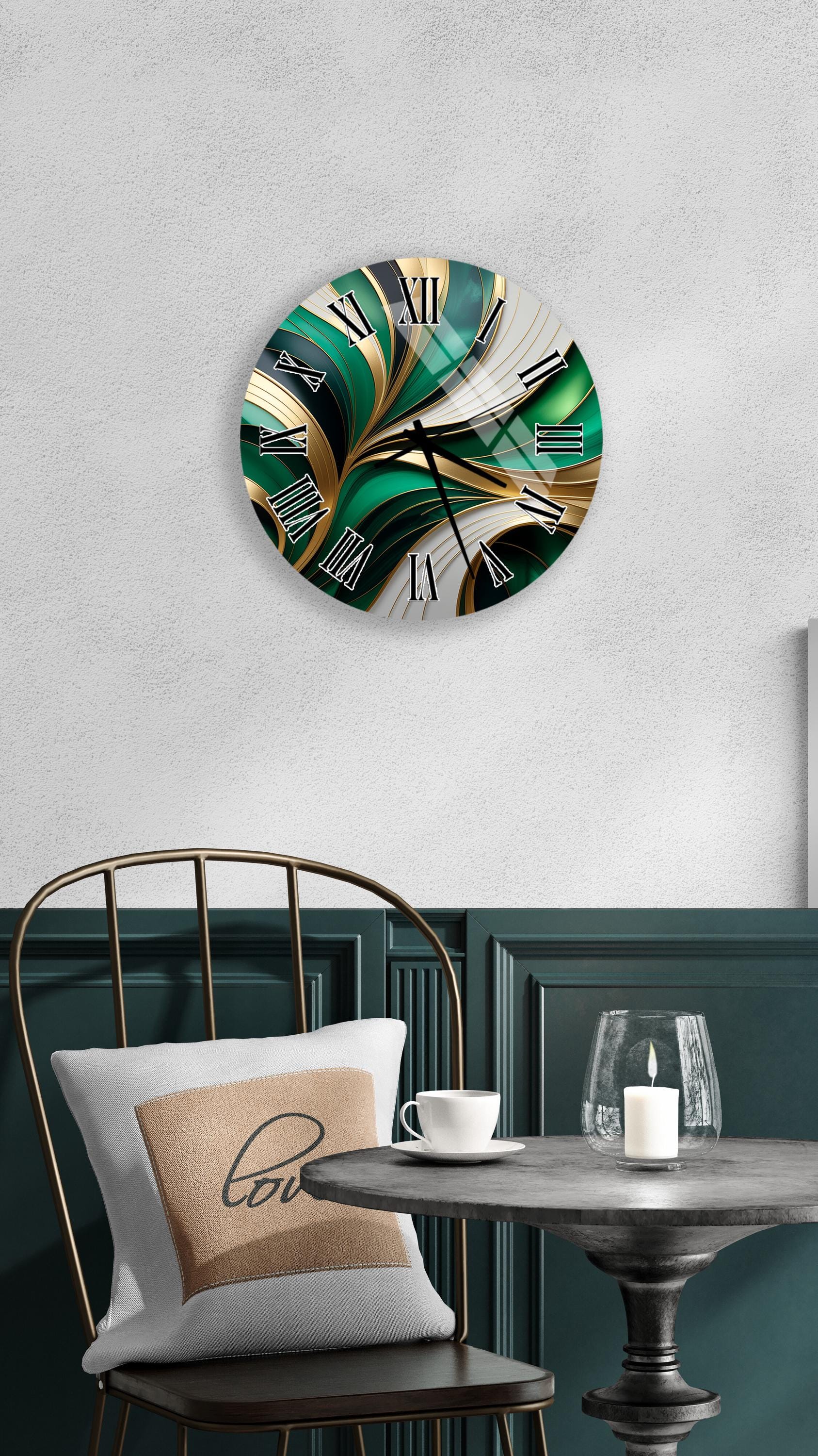 a modern and stylish interior design with a round wall clock featuring a green and gold abstract pattern, a white table with a candle and a cup, and a black metal chair with a white pillow.