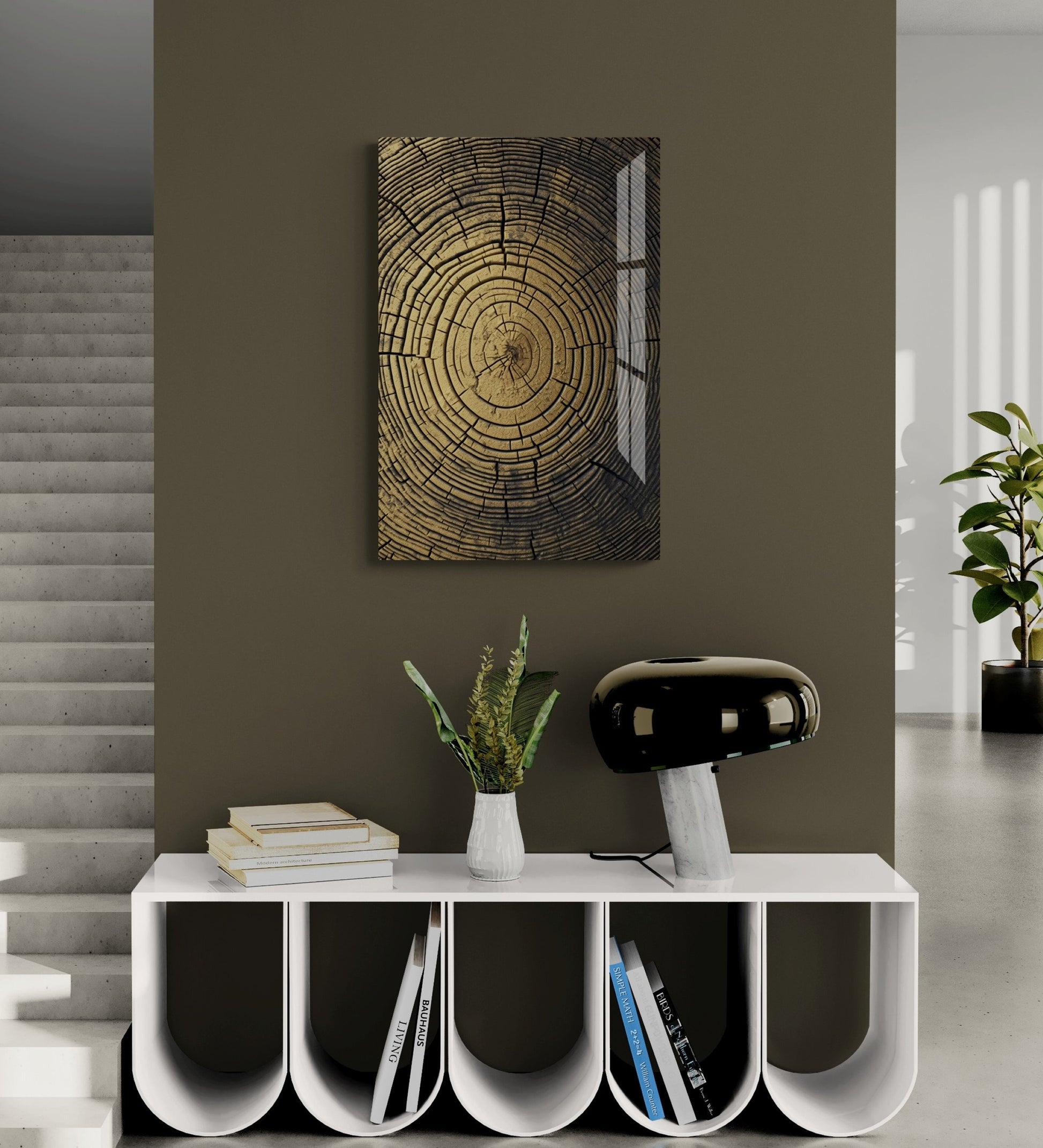 a room with a table, books and a painting on the wall