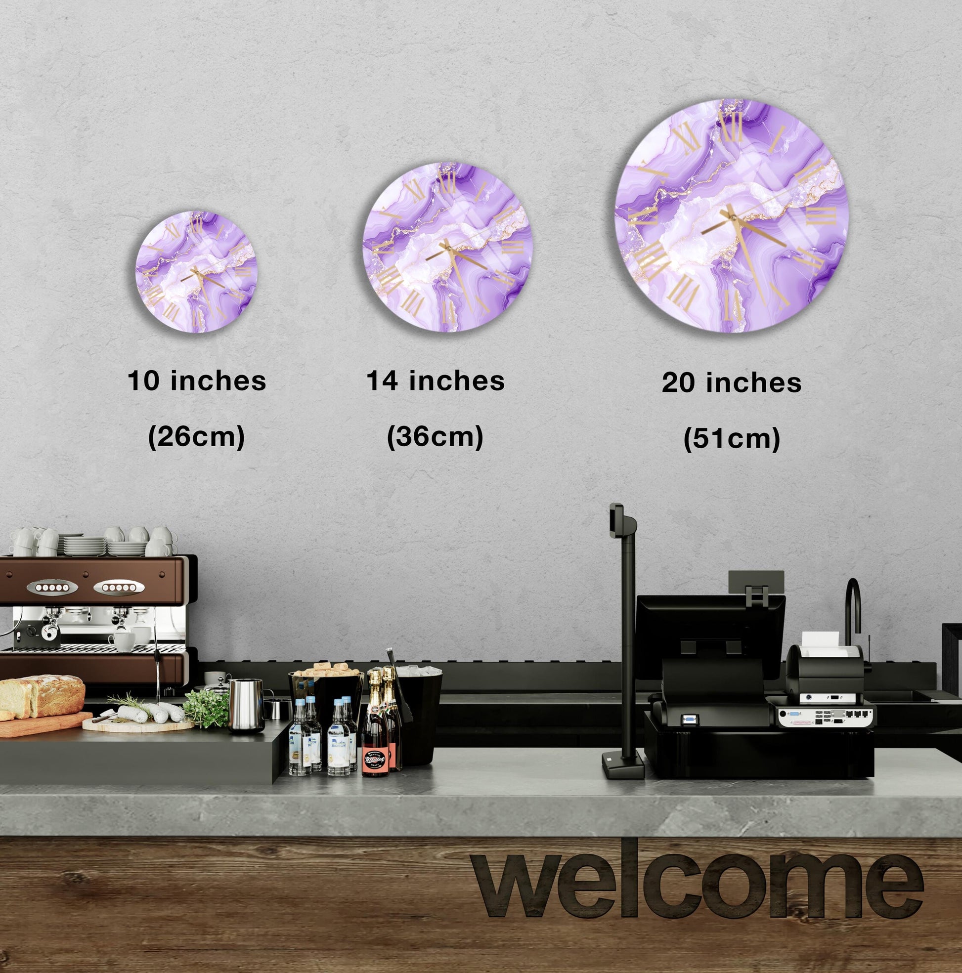 a counter with a cash register, a coffee machine, and various food items such as bottles and bread. Above the counter, there are three clock images of different sizes, each depicting a purple and white design. The image also includes text indicating the sizes of the clock images in inches.