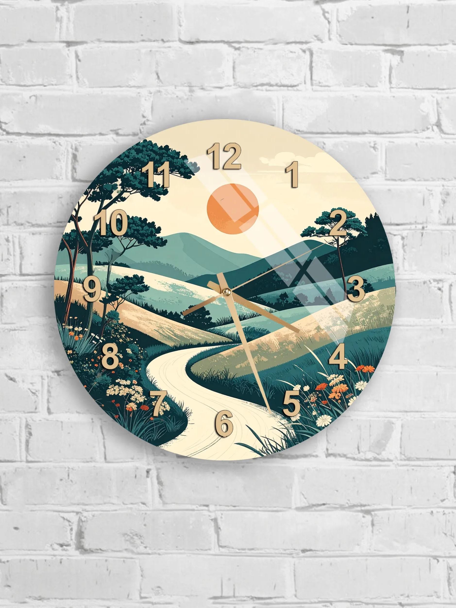 A wall clock with a landscape scene depicting a winding road, trees, and a sun in the sky.