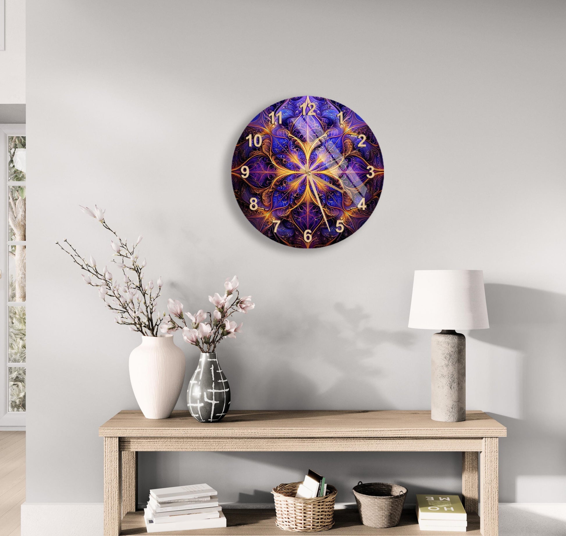 a clock on a wall above a table with a vase of flowers