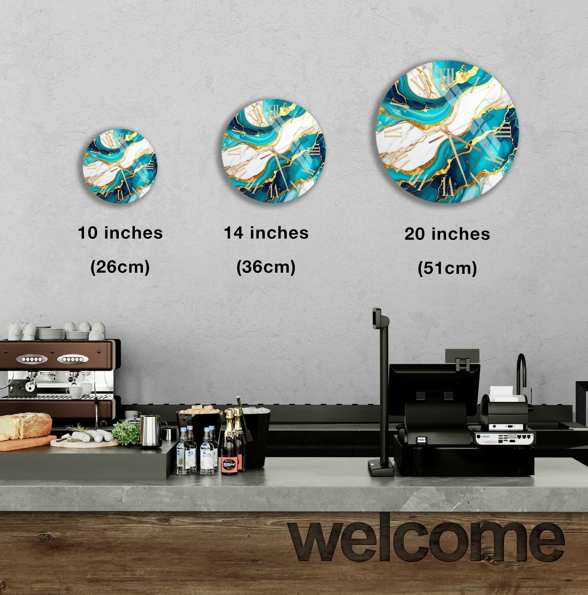 a counter in a restaurant with a "welcome" sign, and three wall-mounted circular art pieces of different sizes, each with a unique design.
