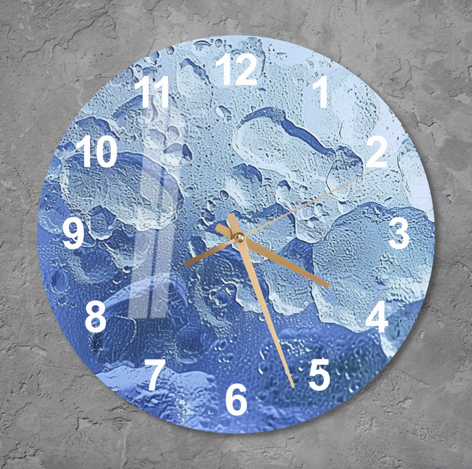 a clock on a wall with water drops on it
