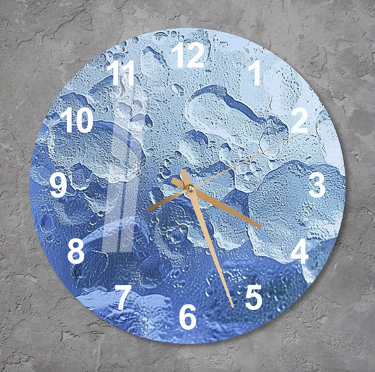 a clock on a wall with water drops on it
