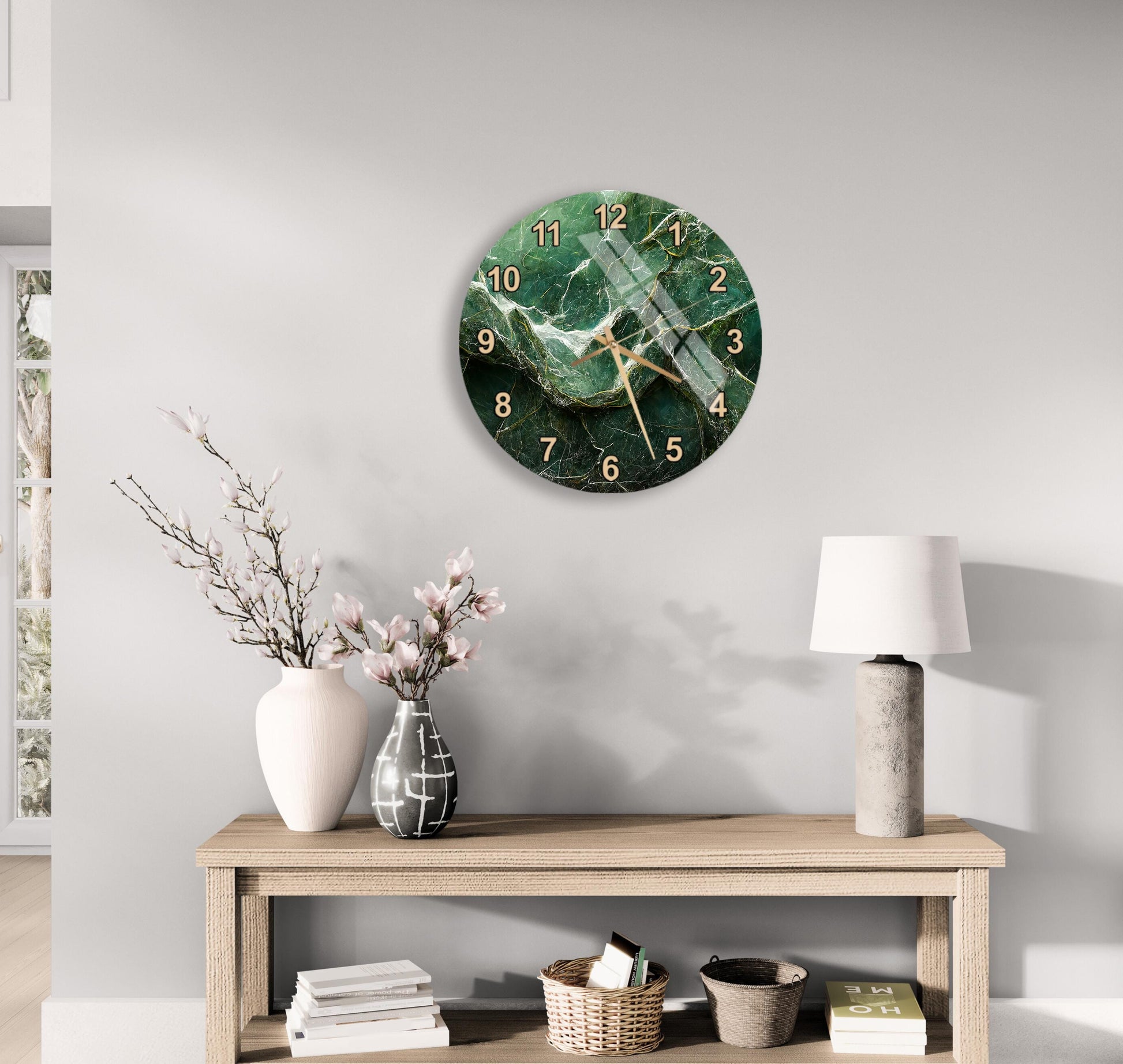 a modern living room with a round wall clock displaying the time as 12:30, a wooden table with a lamp, a vase with flowers, and a stack of books.