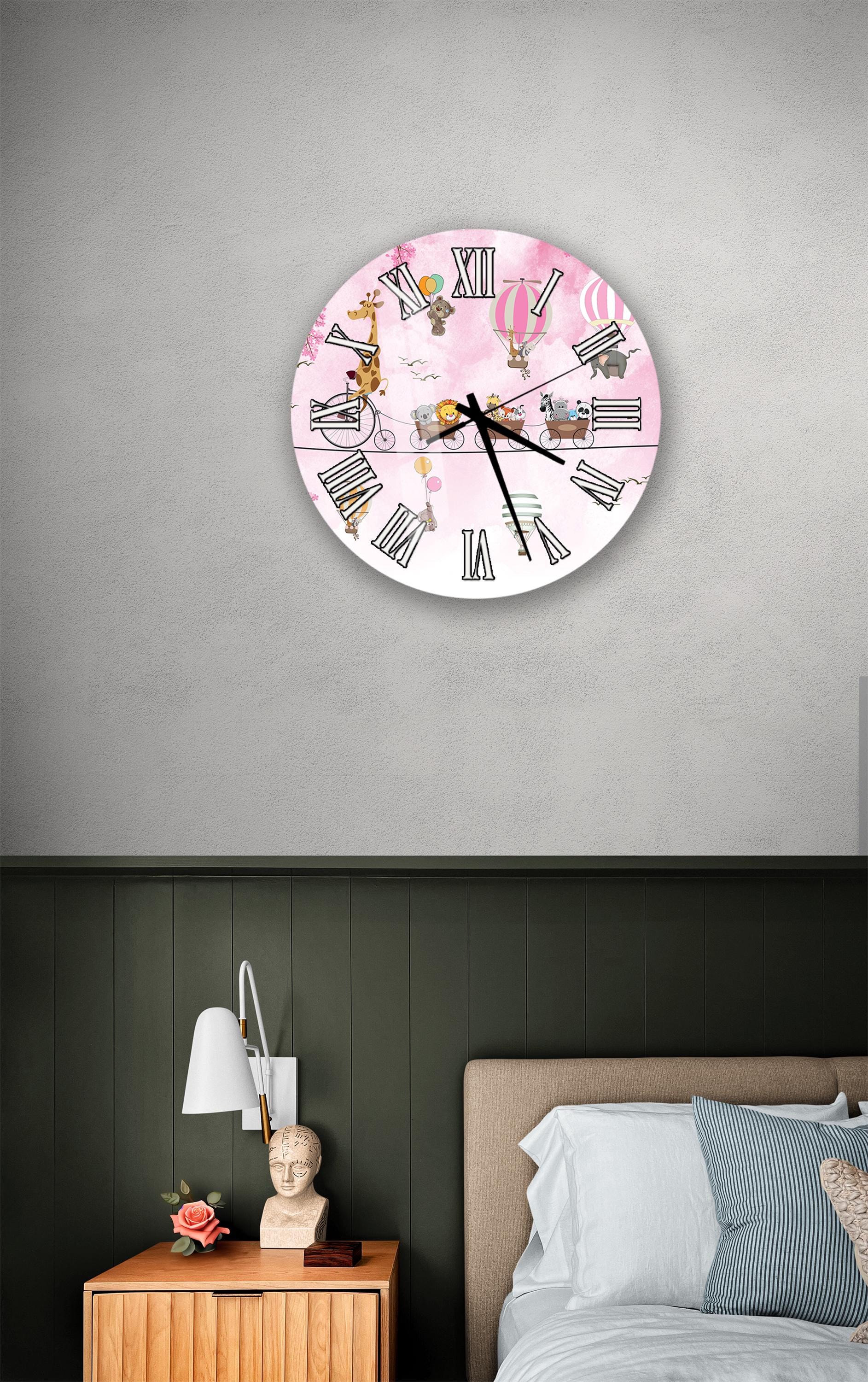 a bedroom setting with a clock on the wall, a nightstand with a lamp, and a bed with white sheets.